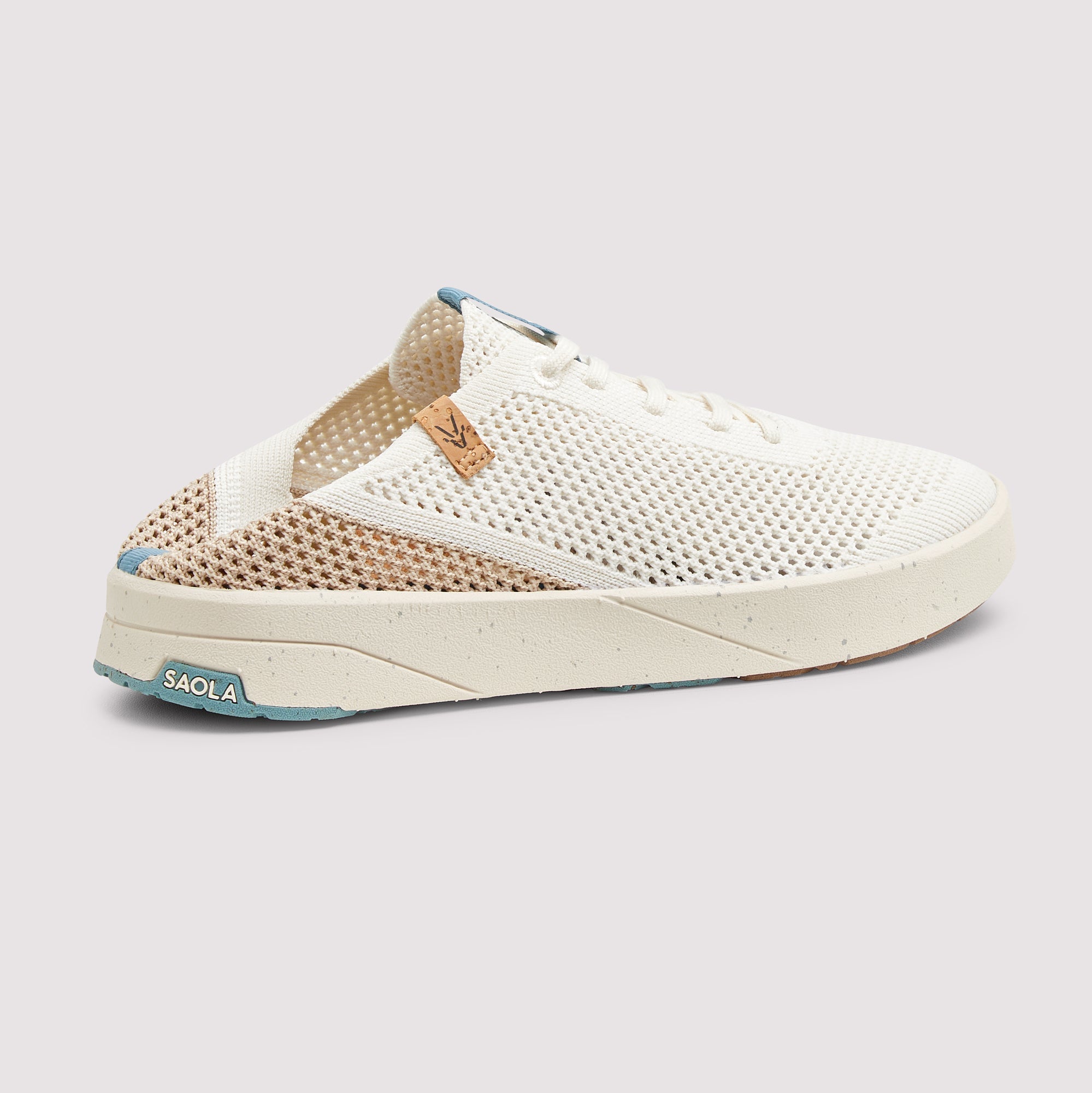 A white mesh slip-on sneaker with beige knit side panels, a white speckled sole, and light blue accents on the heel and tongue, shown against a light gray background.