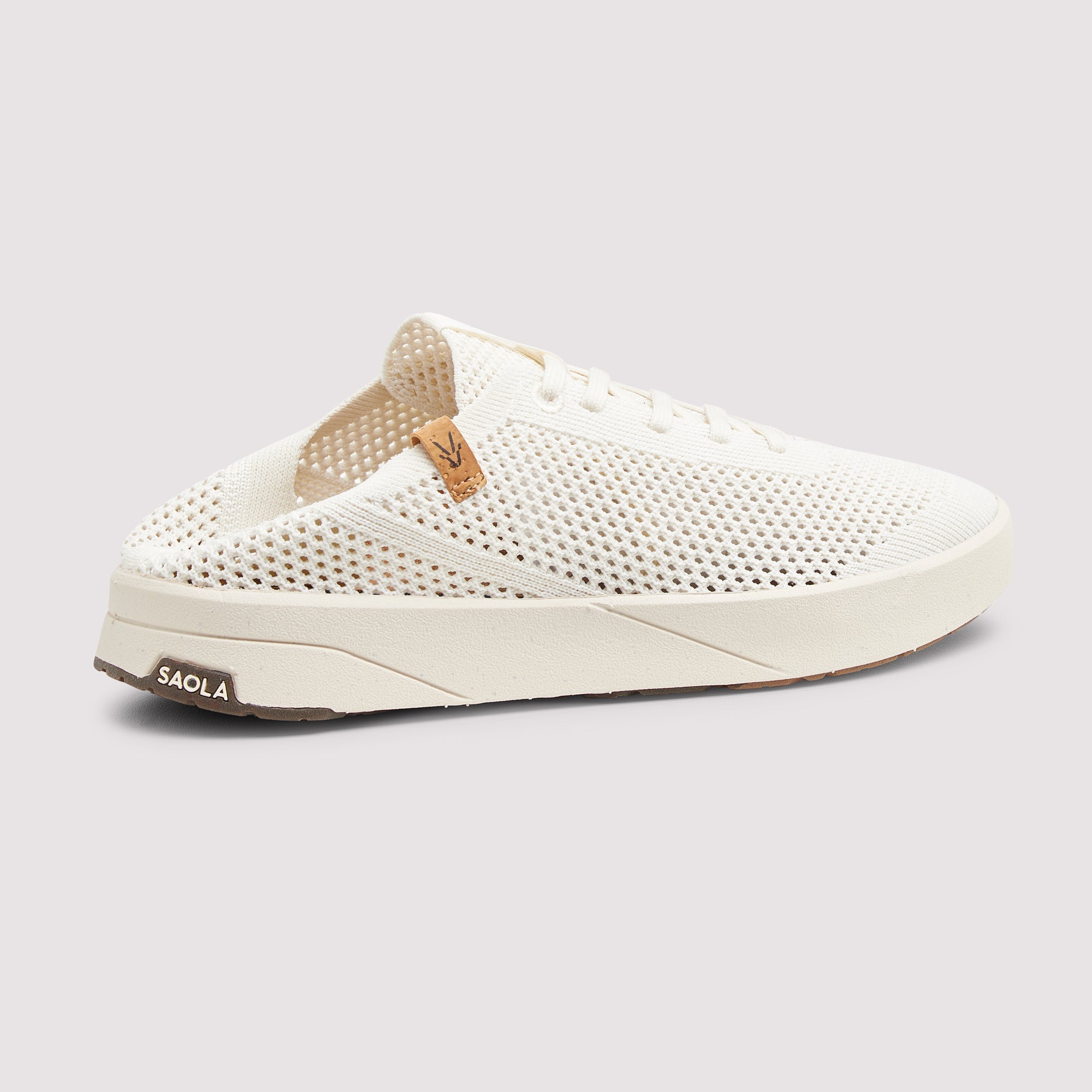 A single off-white knit slip-on sneaker with a perforated upper, white laces, a thick white sole, and a small tan leather heel tab. The brand name 'SAOLA' is visible on the heel of the sole, set against a light gray background.