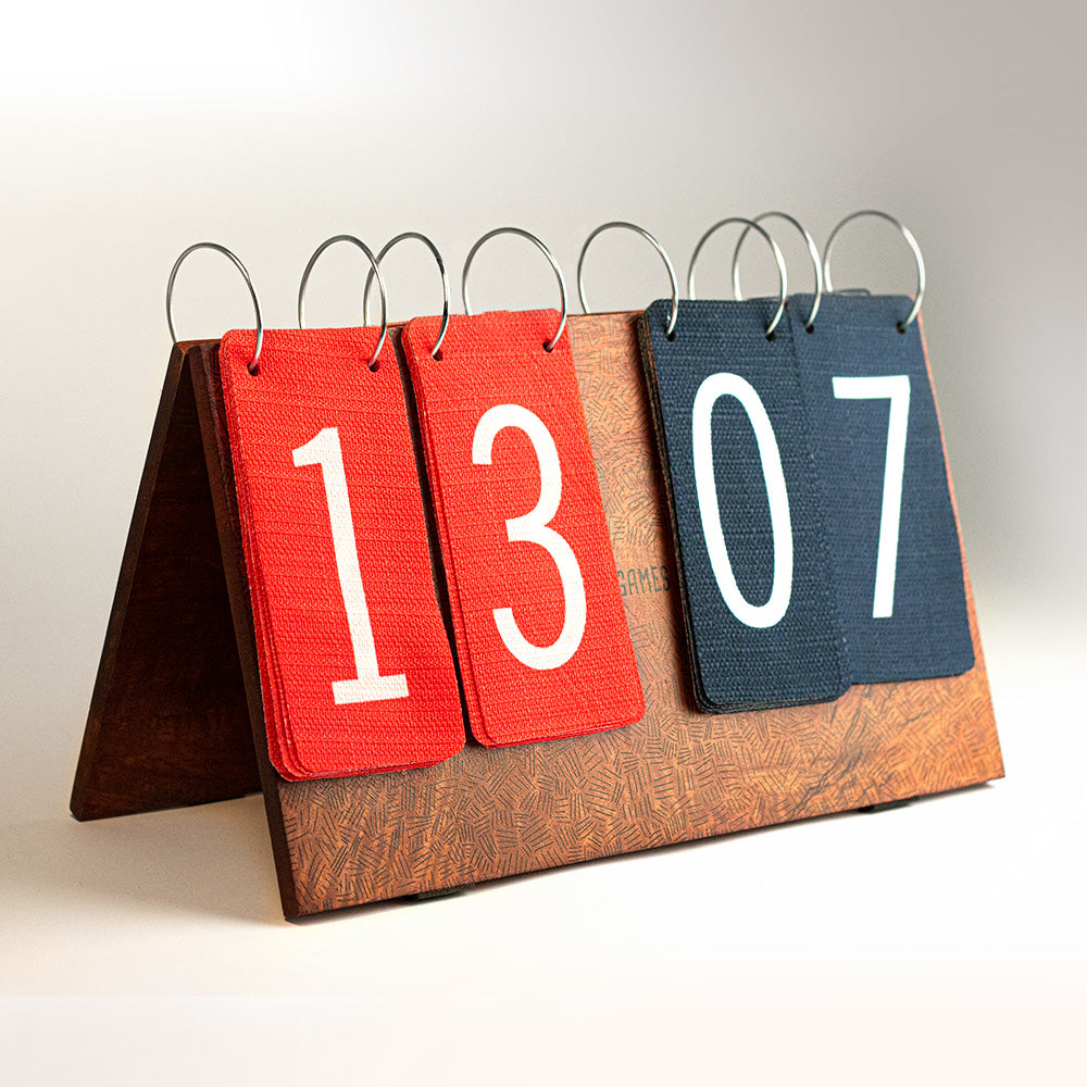 Calendar with red, blue, and brown pages displaying numbers.
