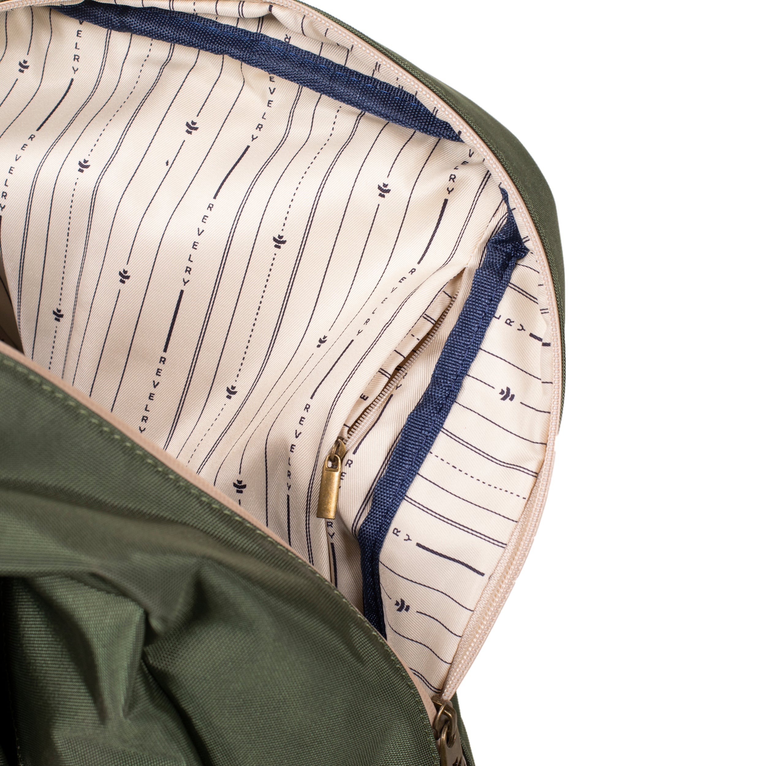 Close-up of a green bag with a patterned interior pocket on a white background