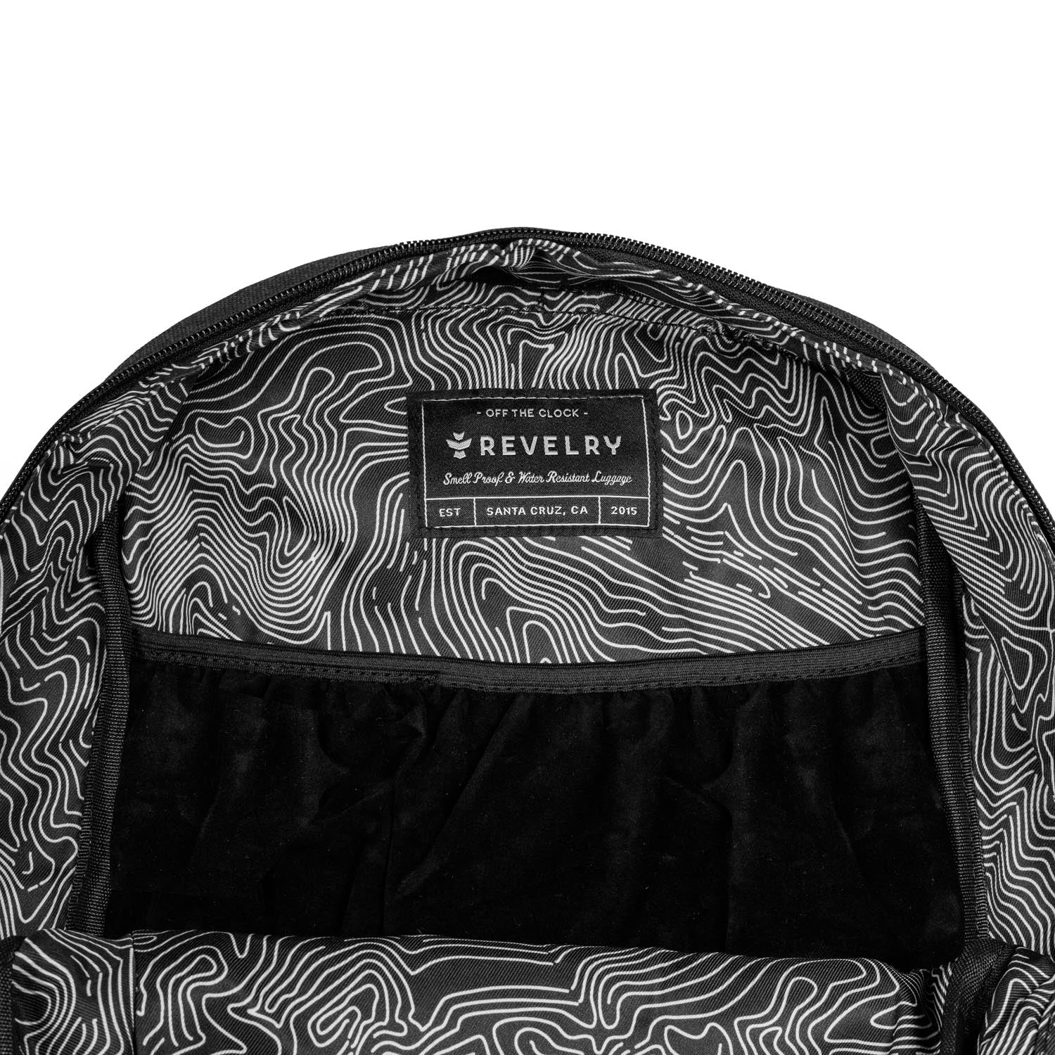 Backpack interior with topographic pattern and Revelry logo