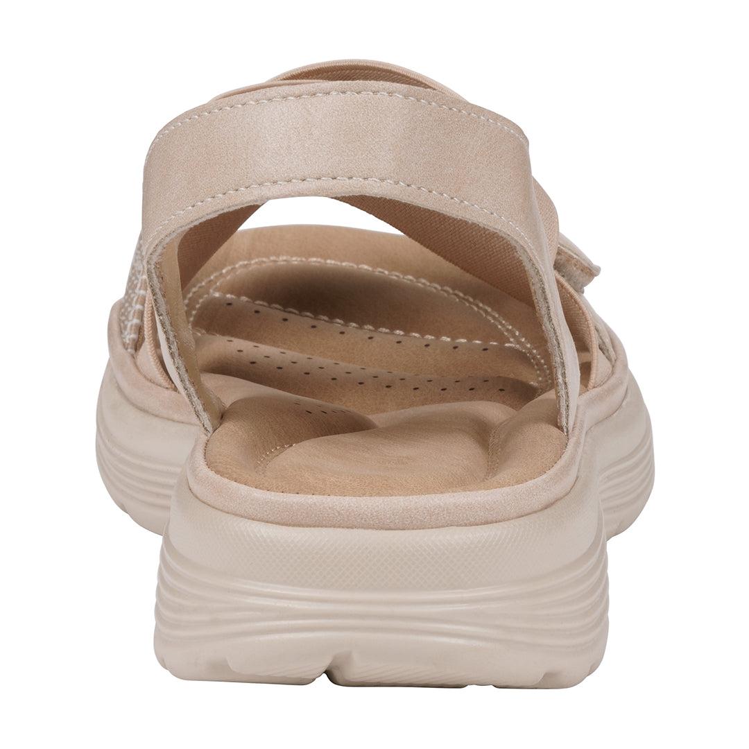 Beige sandal with multiple straps on a white background
