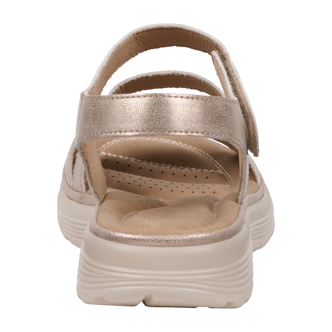 Beige sandal with a platform sole on a white background