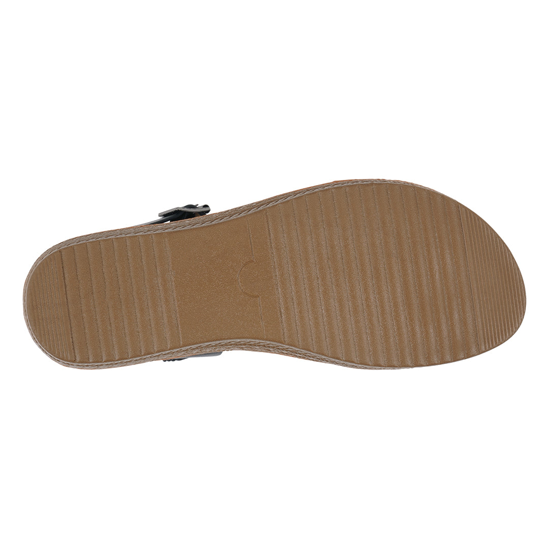 Black sandal sole with geometric pattern on a white background