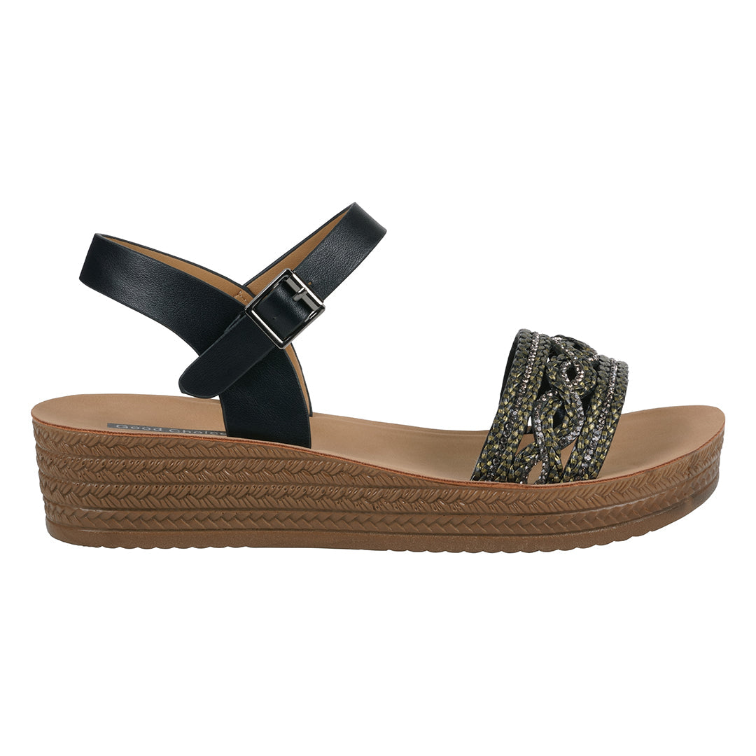 Black sandal with woven sole on a white background