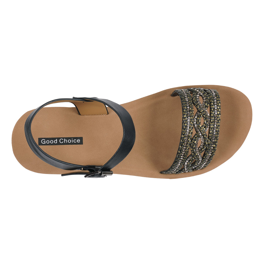Tan sandal with black strap and decorative embellishments on a white background