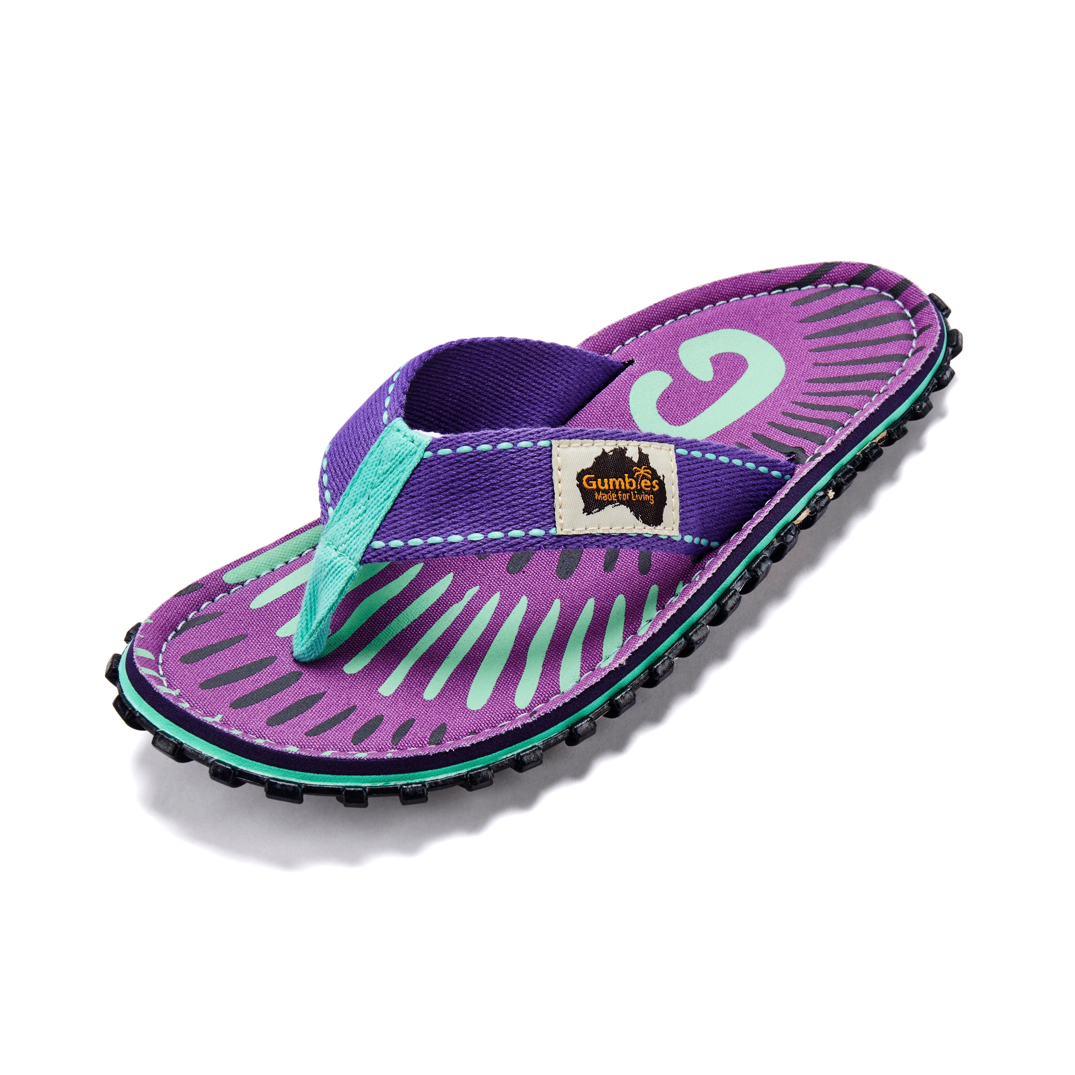 Purple sandal with green sole on a white background
