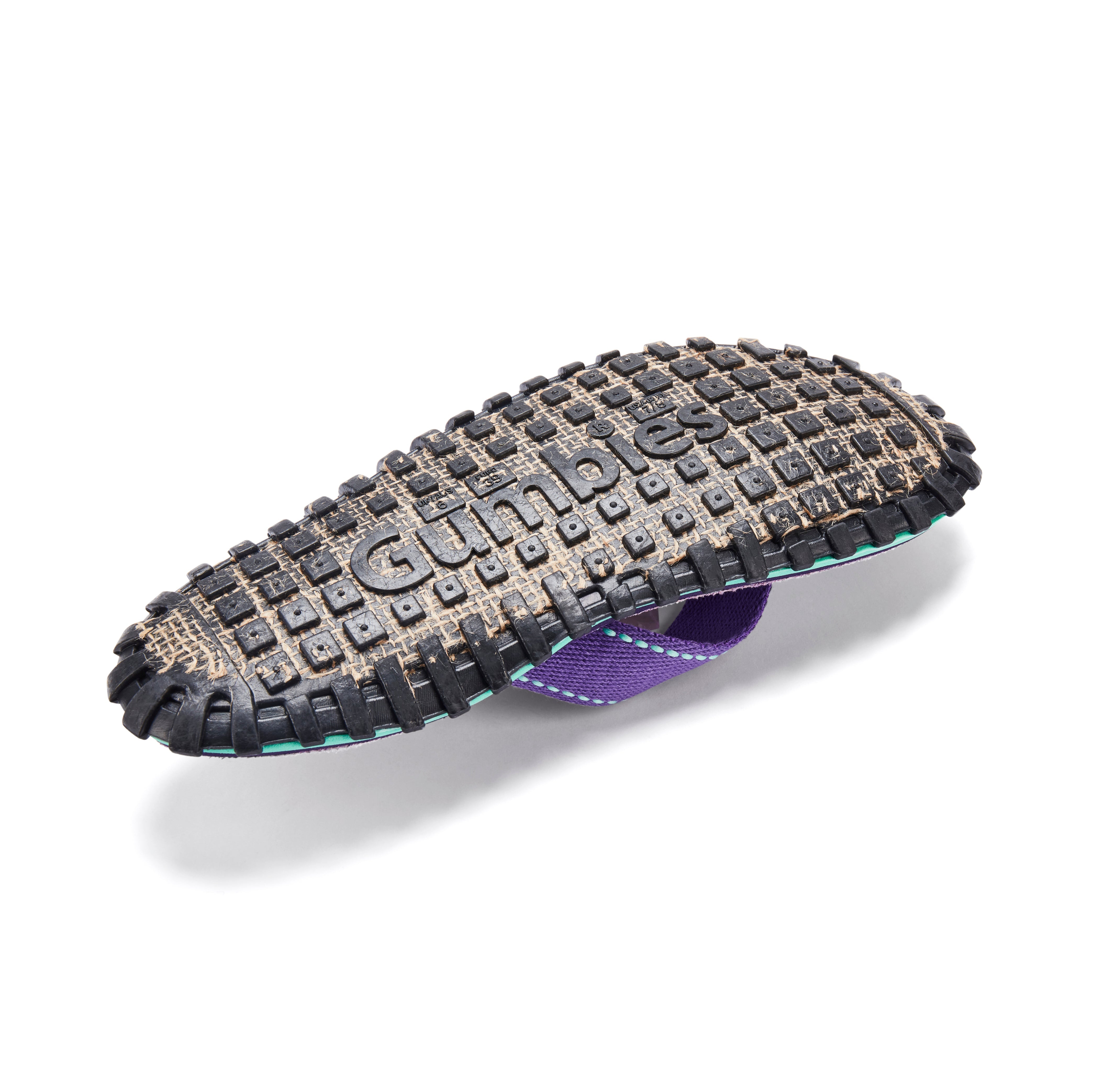 Gumbler dog toy with tread pattern on a white background