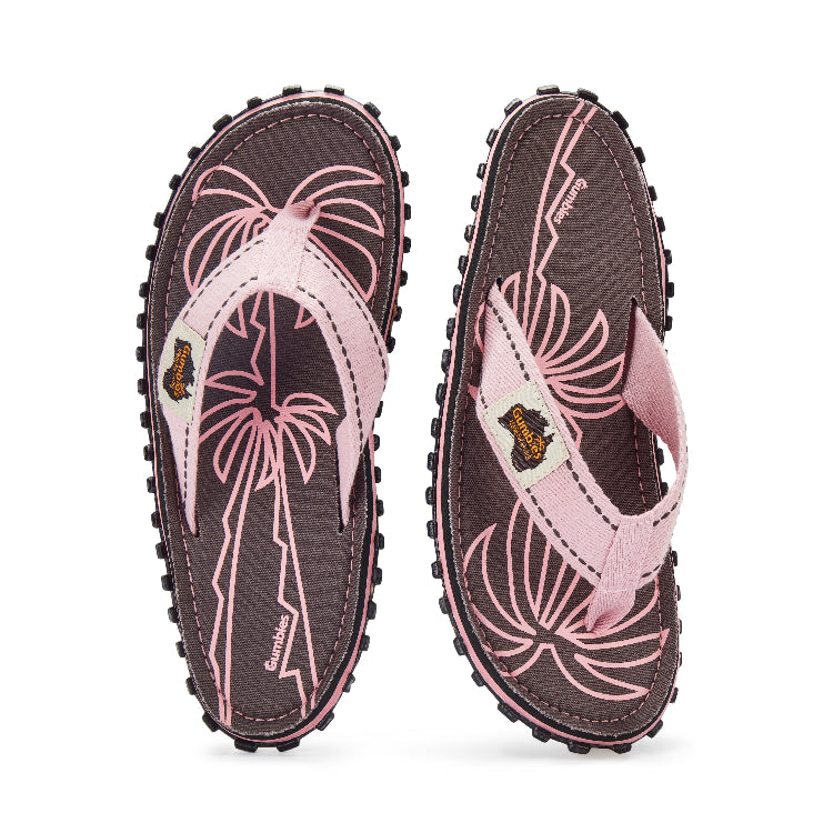 Pair of flip-flops with pink floral design on a white background