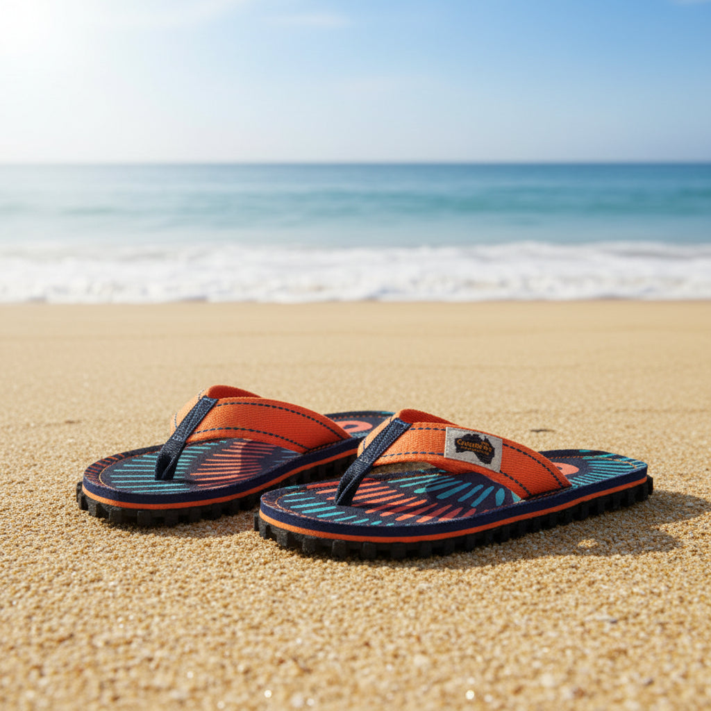 Pair of colorful flip-flops with a brand logo on a white background
