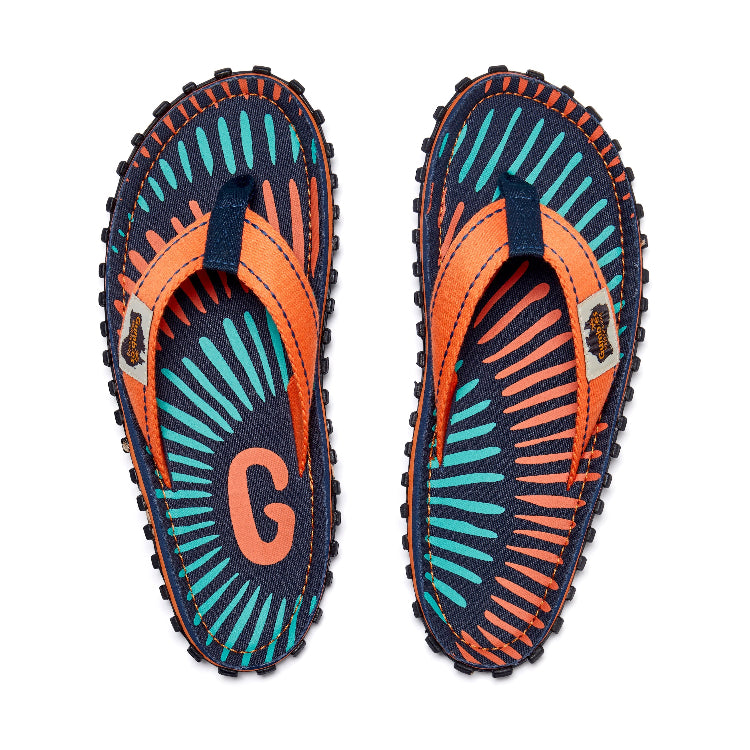 Pair of colorful flip-flops with a pattern on a white background