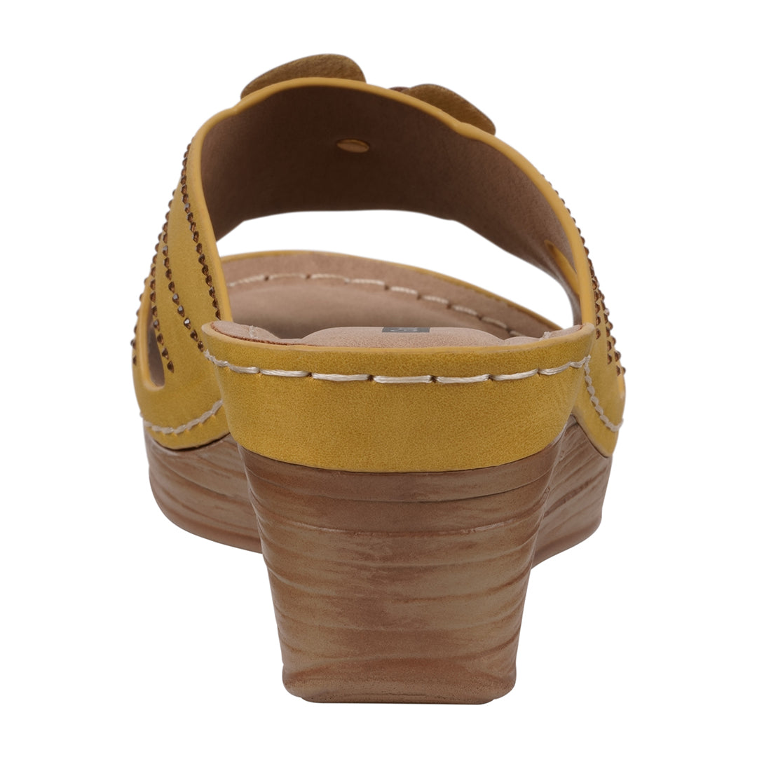 Yellow sandal with a brown sole on a white background