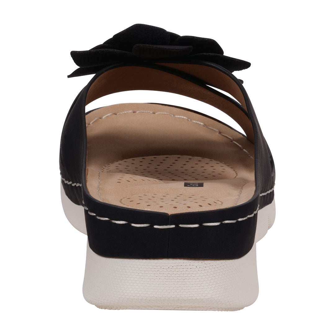Black sandal with a bow on a white background