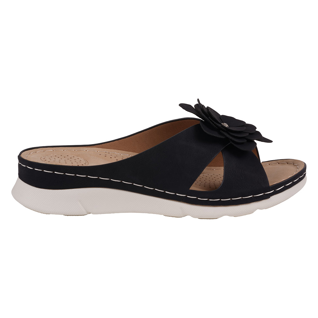 Green sandal with a knot design on a white background