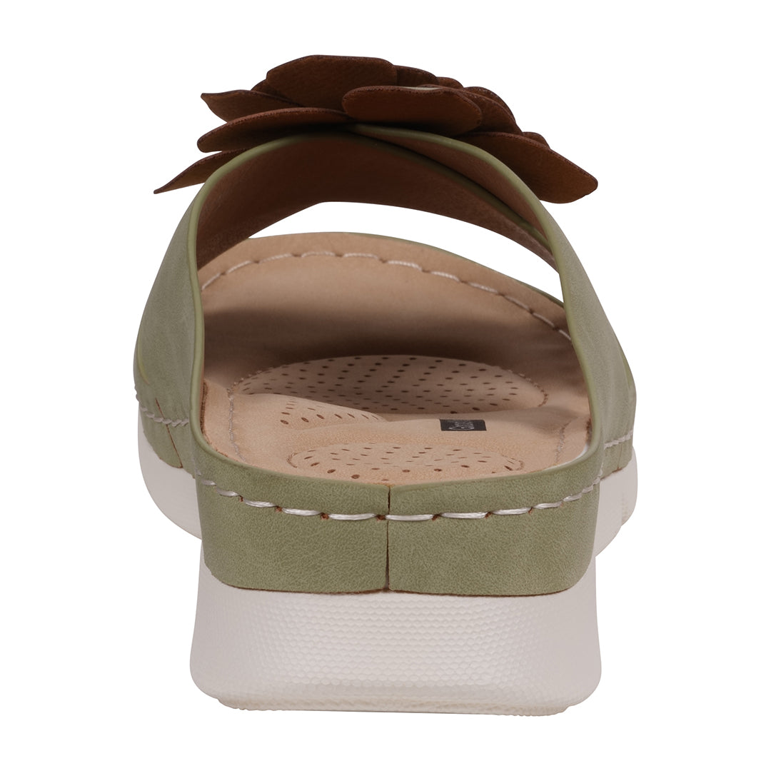 Green sandal with a brown flower on a white background