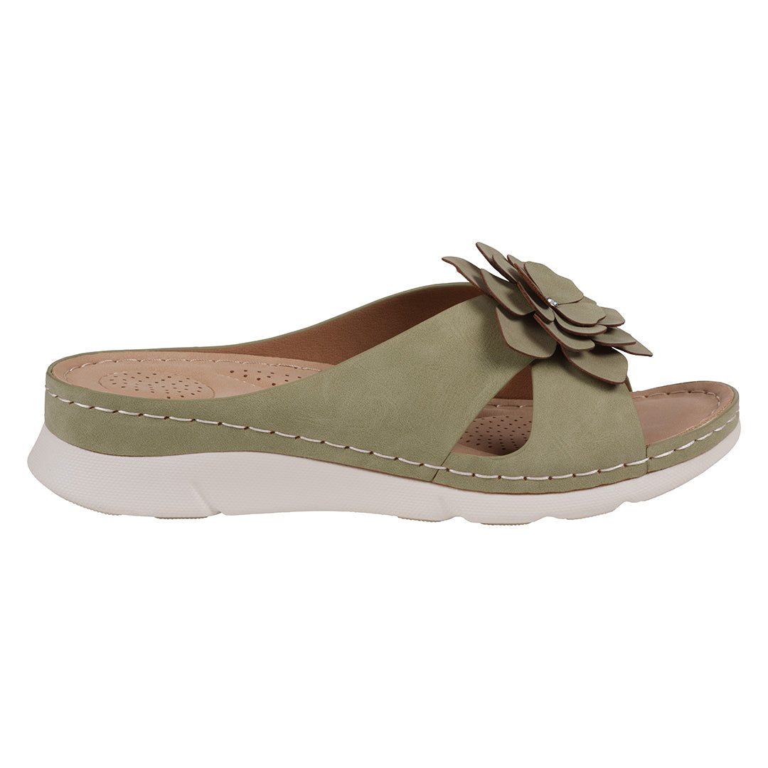 Green sandal with a flower detail on a white background