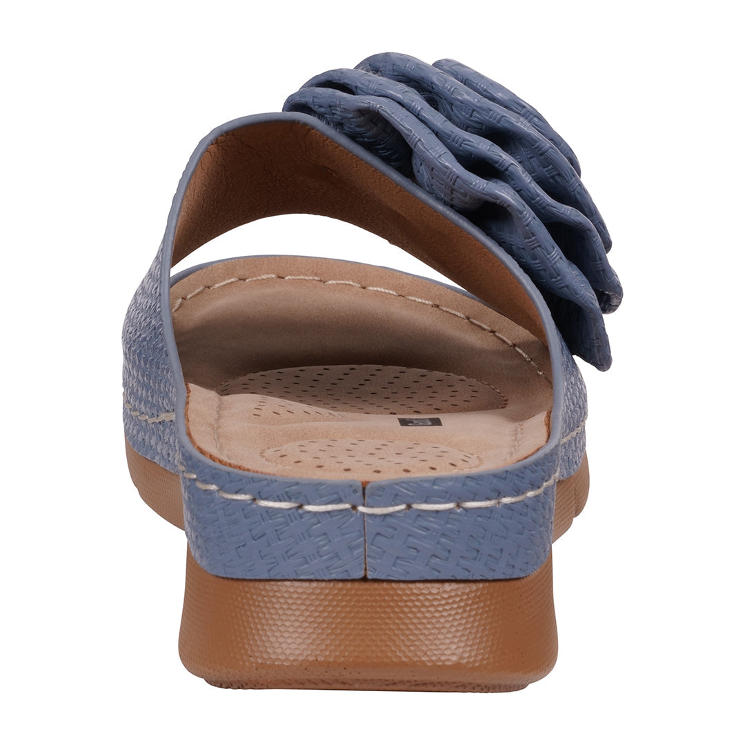 Blue sandal with a flower detail on a white background
