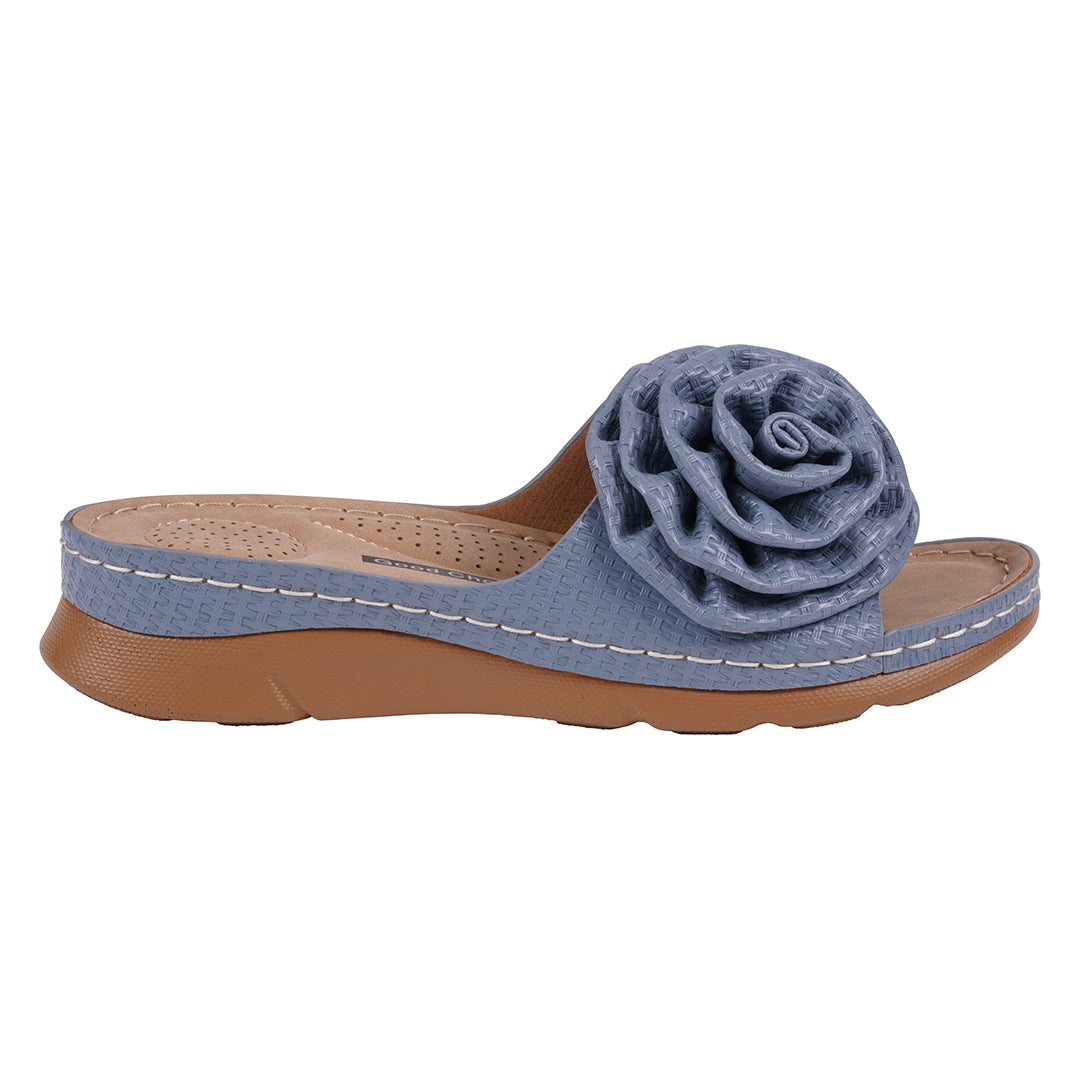 Blue sandal with a flower detail on a white background