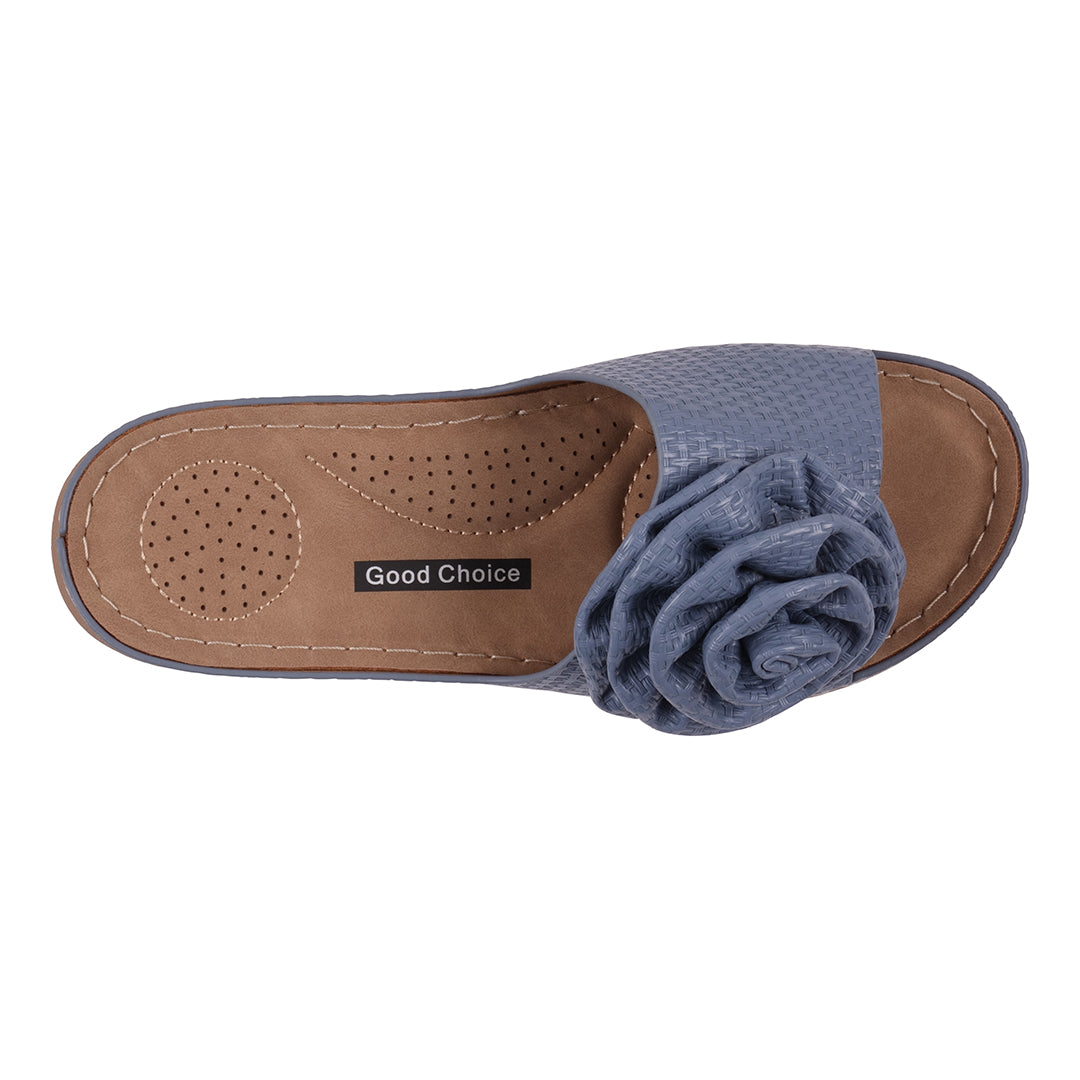 Blue sandal with a flower detail on a white background