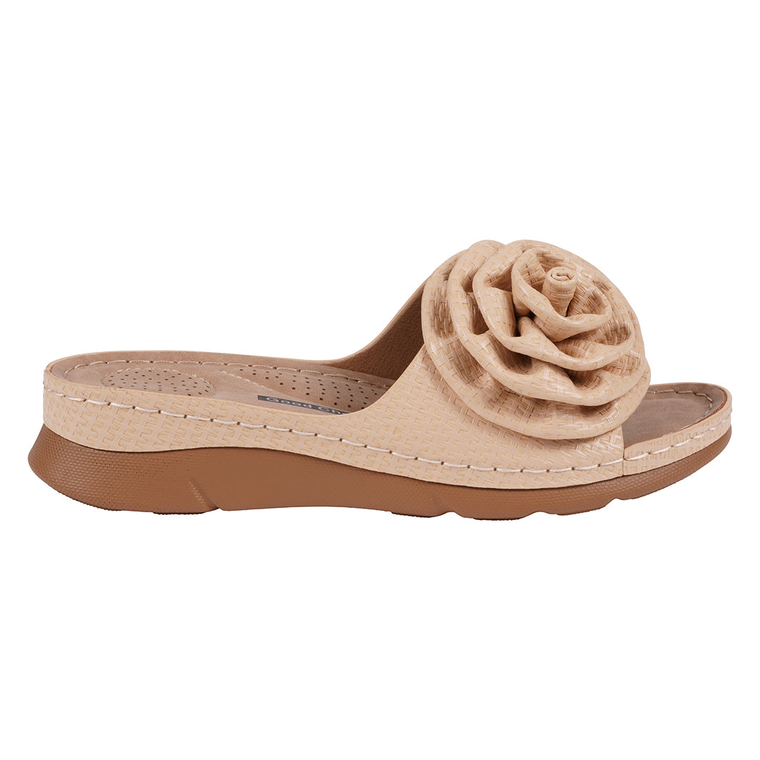 Beige sandal with a flower detail on a white background