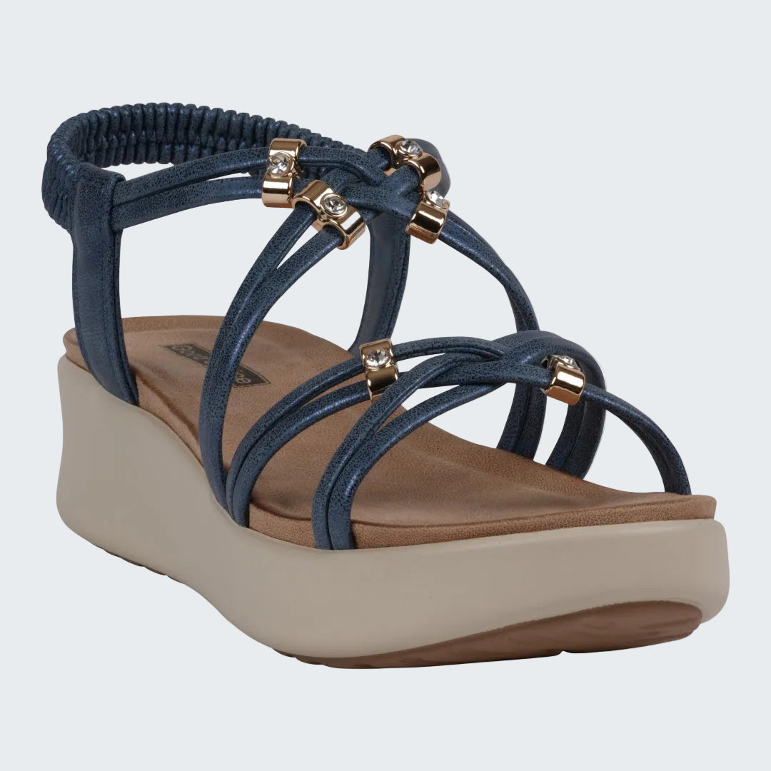 Blue sandal with gold accents on a white background