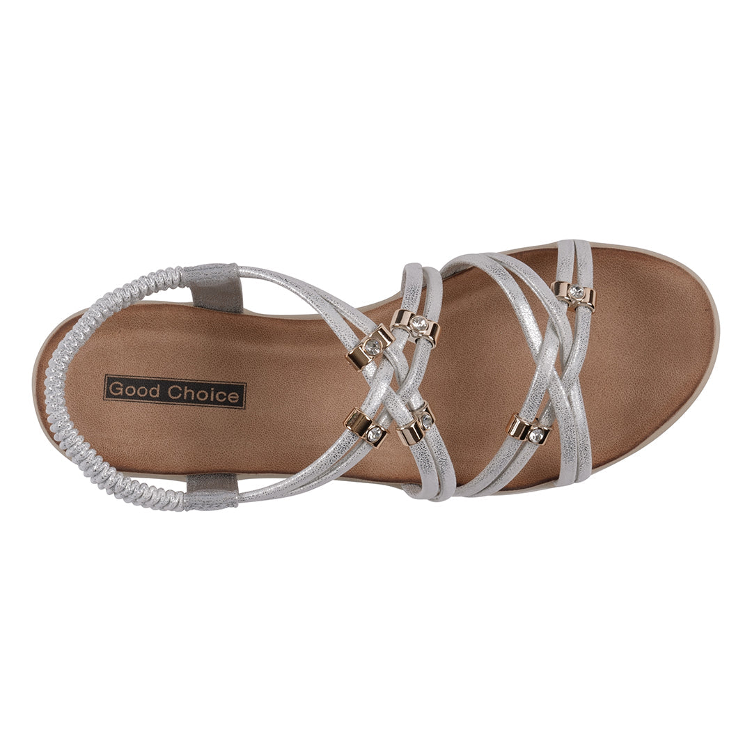 White sandal with criss-cross straps on a white background