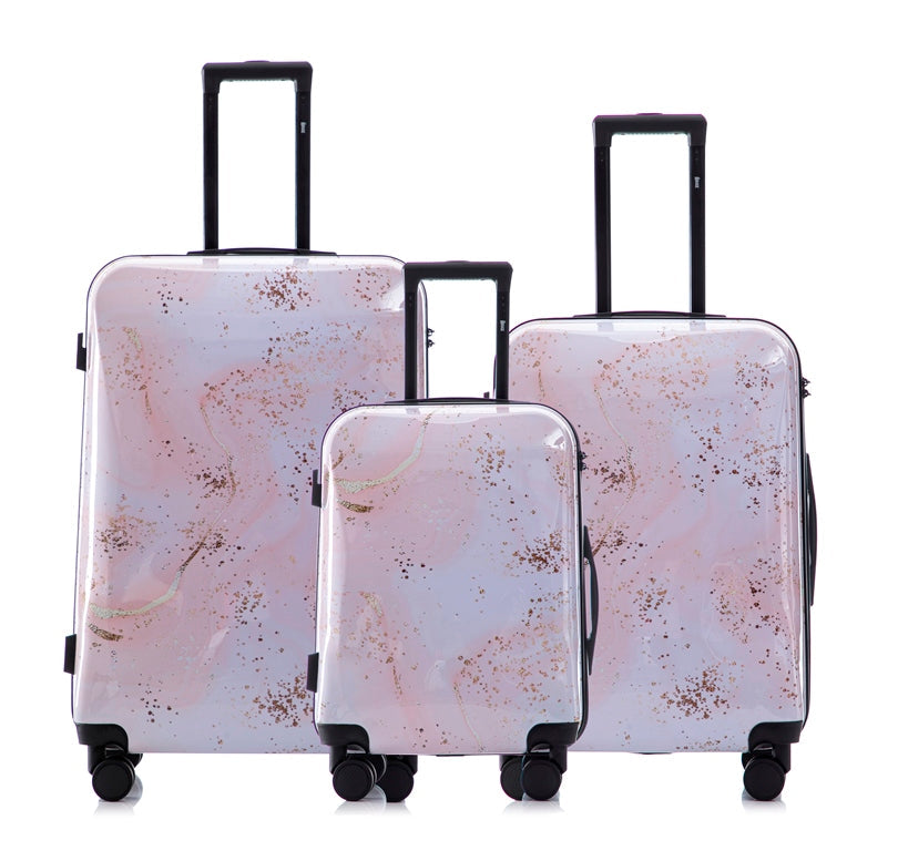 Set of three luggage pieces with a floral pattern on a white background