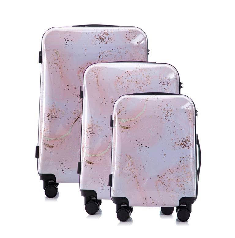 Set of three marble-patterned suitcases on a white background