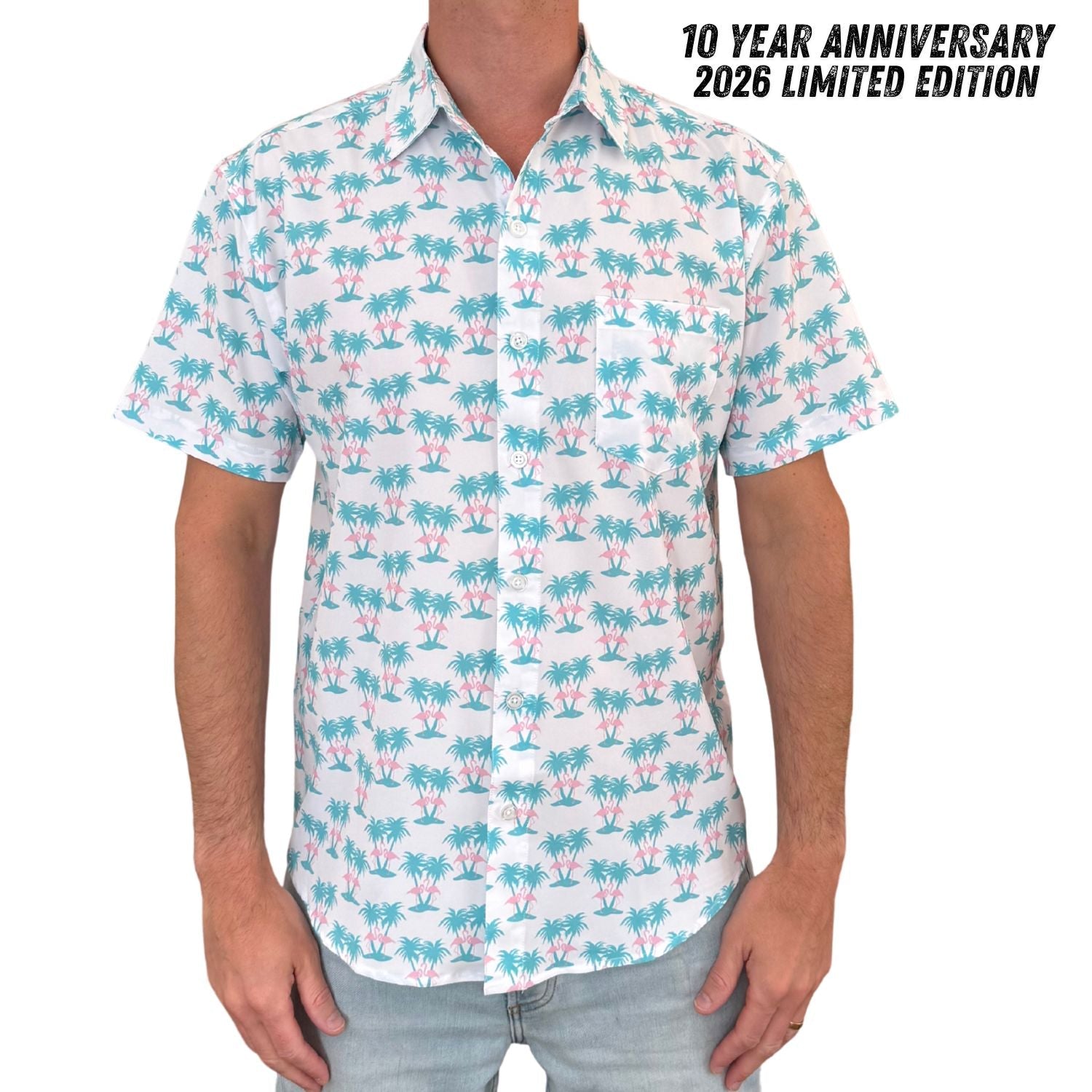 Person wearing a patterned shirt with palm trees and flamingos, labeled '10 Year Anniversary 2026 Limited Edition'.
