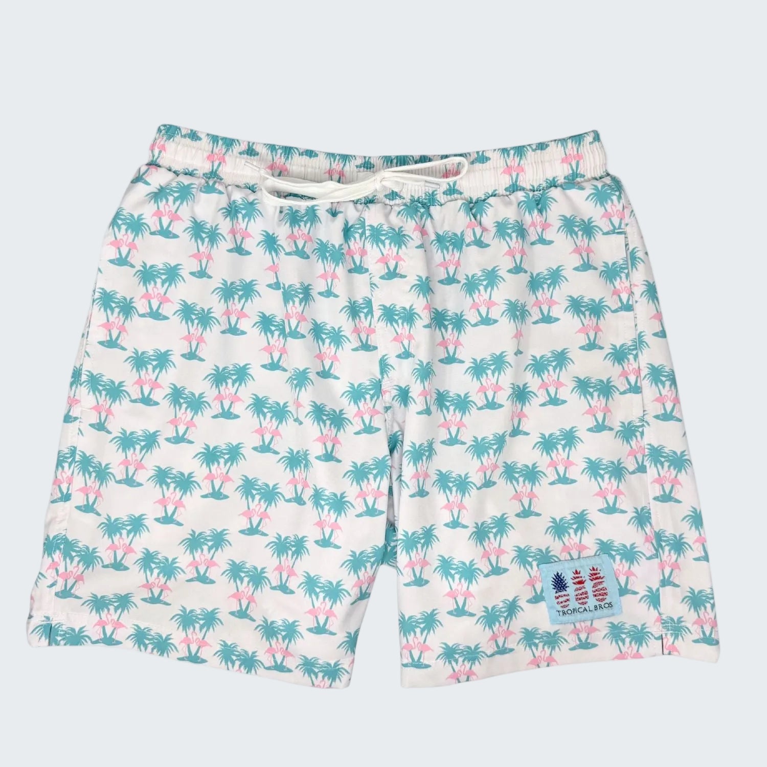 Tropical patterned shorts with palm tree design on a white background, featuring a 10-year anniversary text.