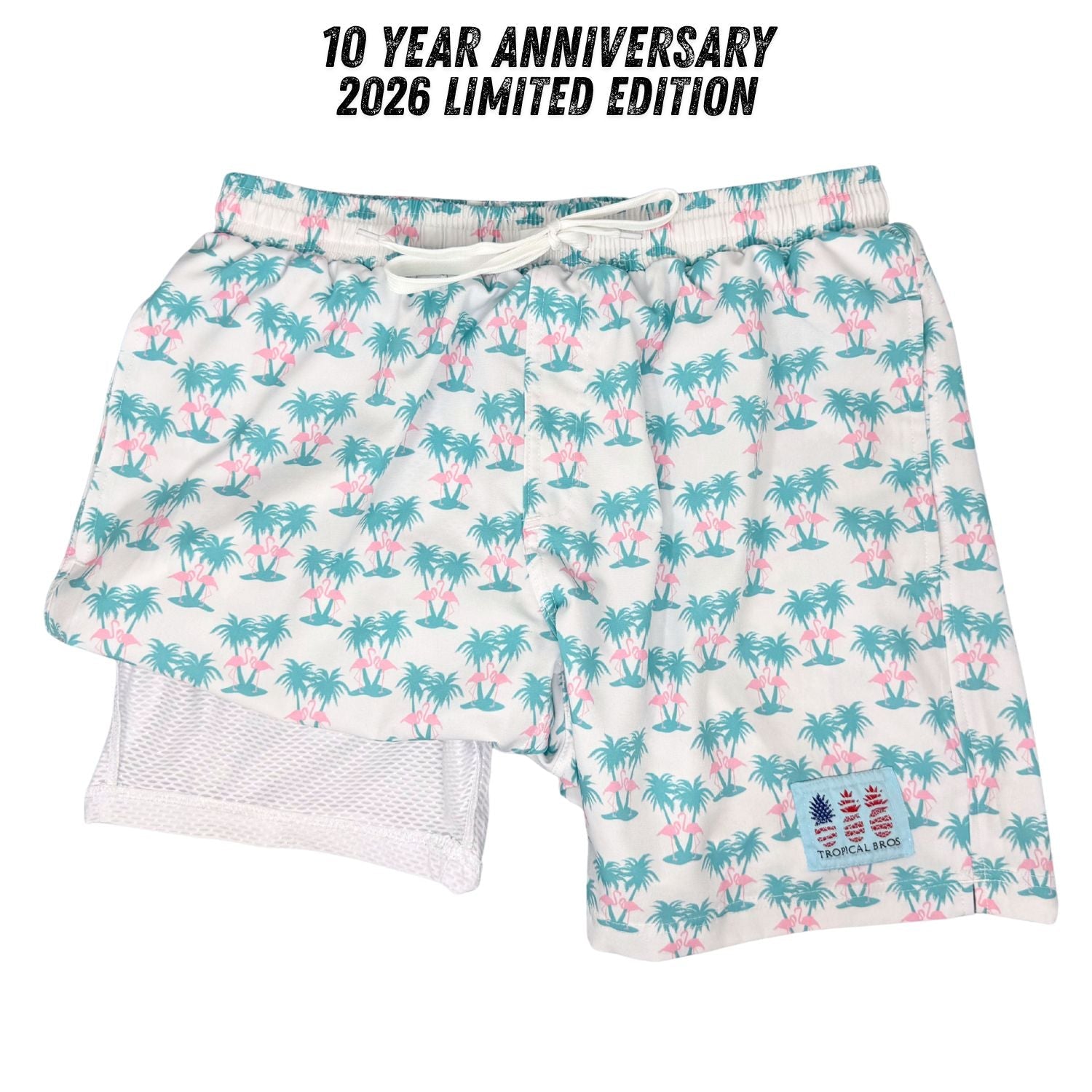 Swim shorts with palm tree pattern and 10 Year Anniversary 2026 Limited Edition text above.
