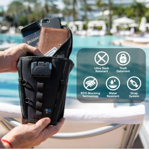 Black security pouch with phone, passport, and cards held by a hand with pool and beach background