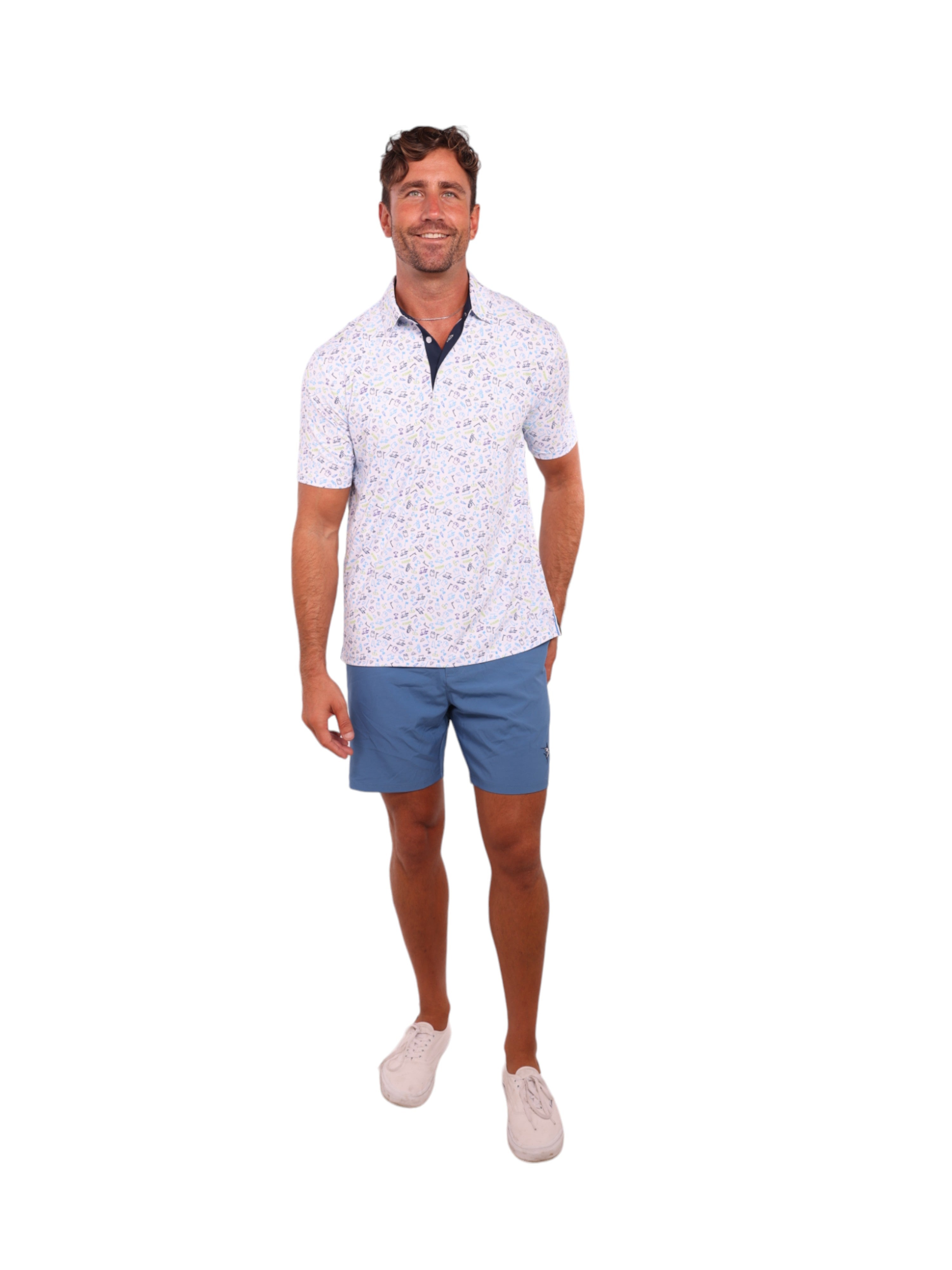 Man wearing a white patterned polo shirt and blue shorts on a white background