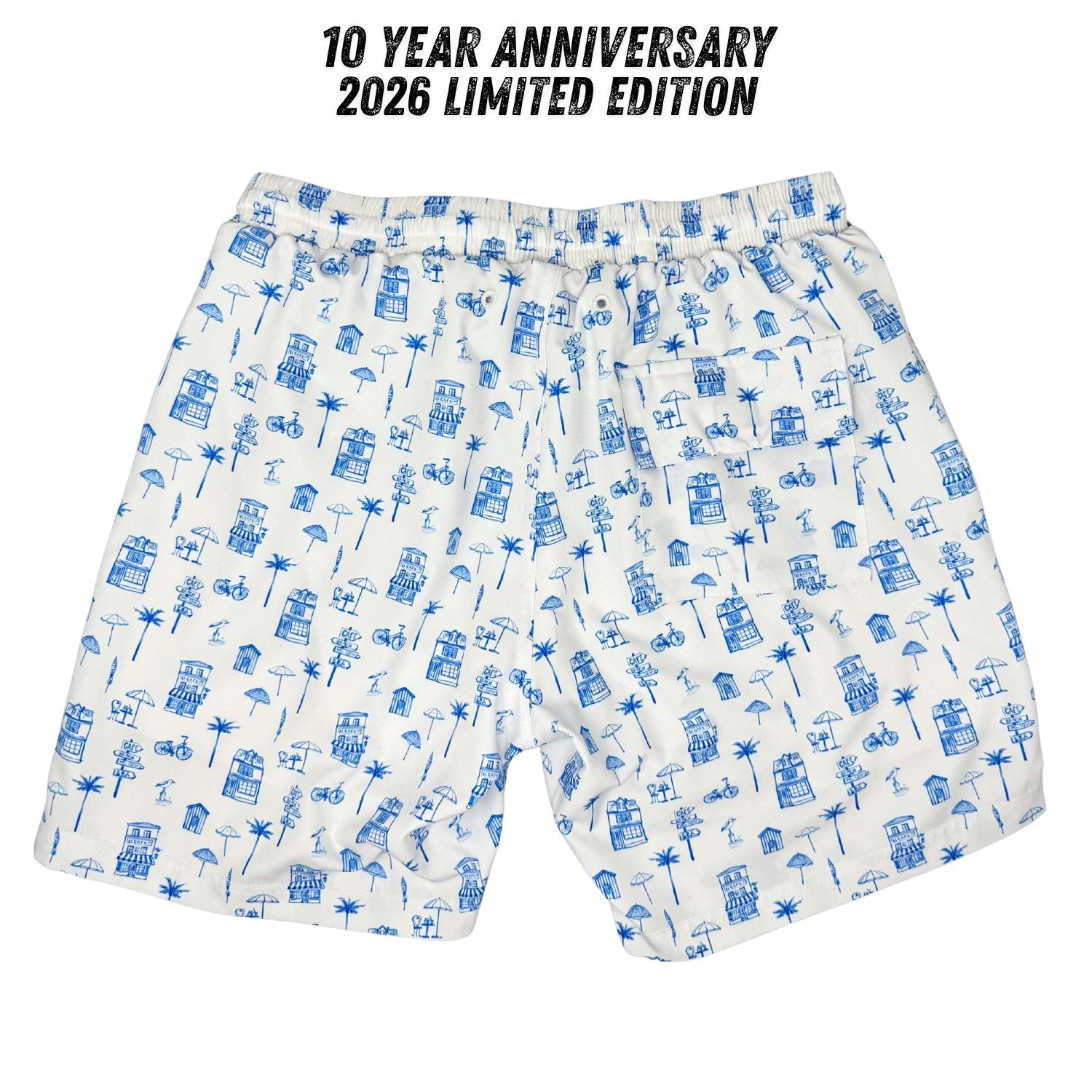 White shorts with blue pattern and '10 Year Anniversary 2026 Limited Edition' text on a white background
