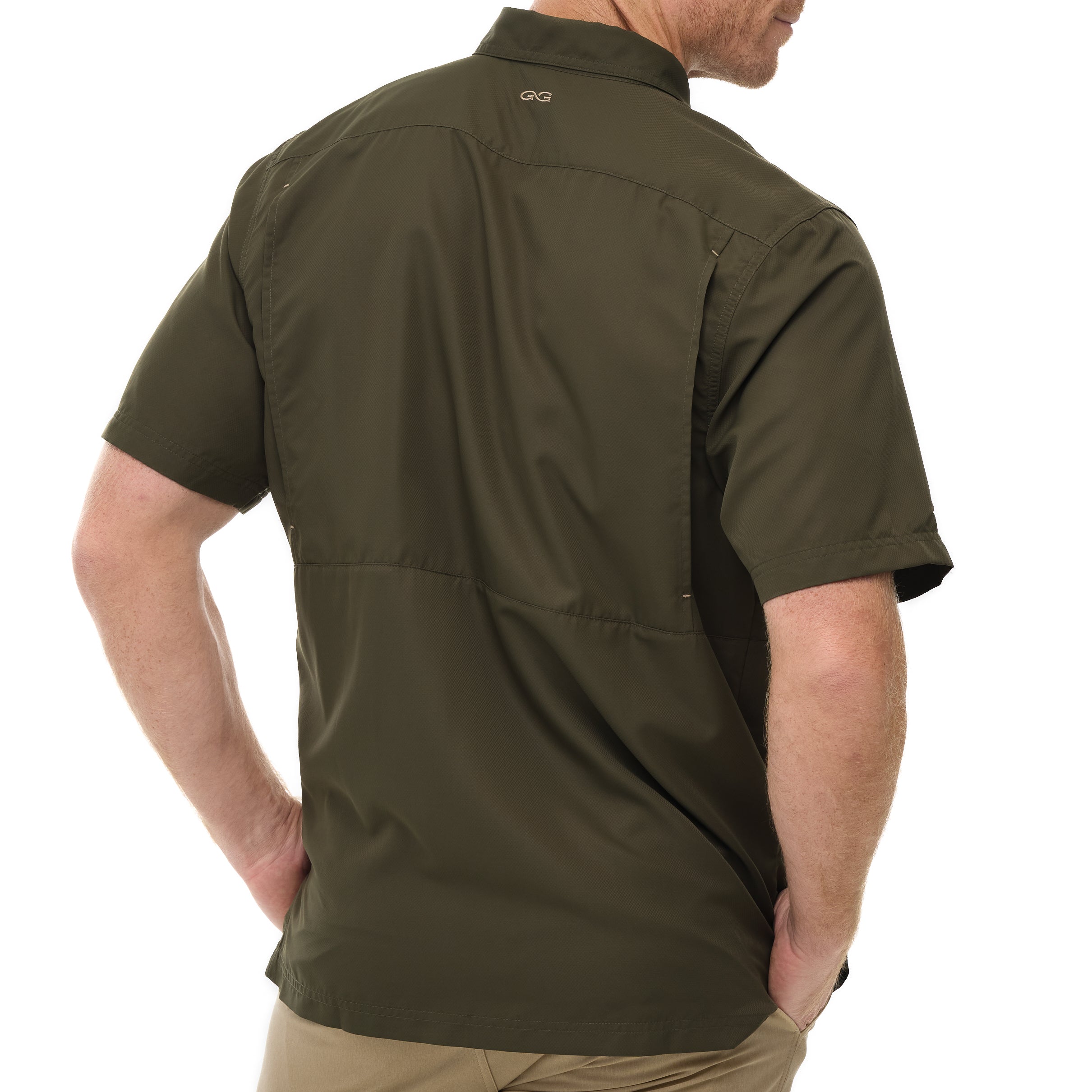 Olive green short-sleeve shirt worn by a person on a white background