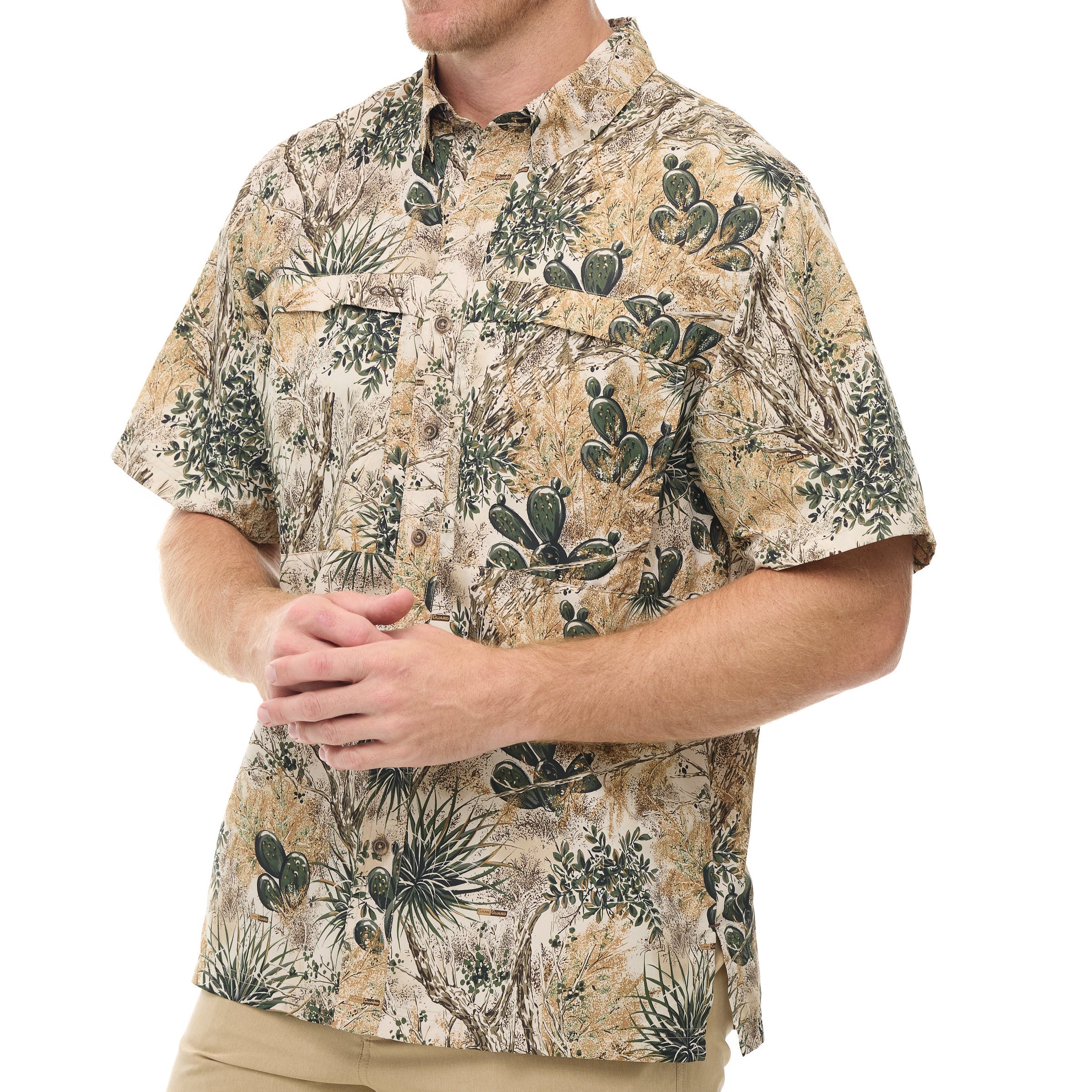 Man wearing a patterned shirt with cactus design on a white background