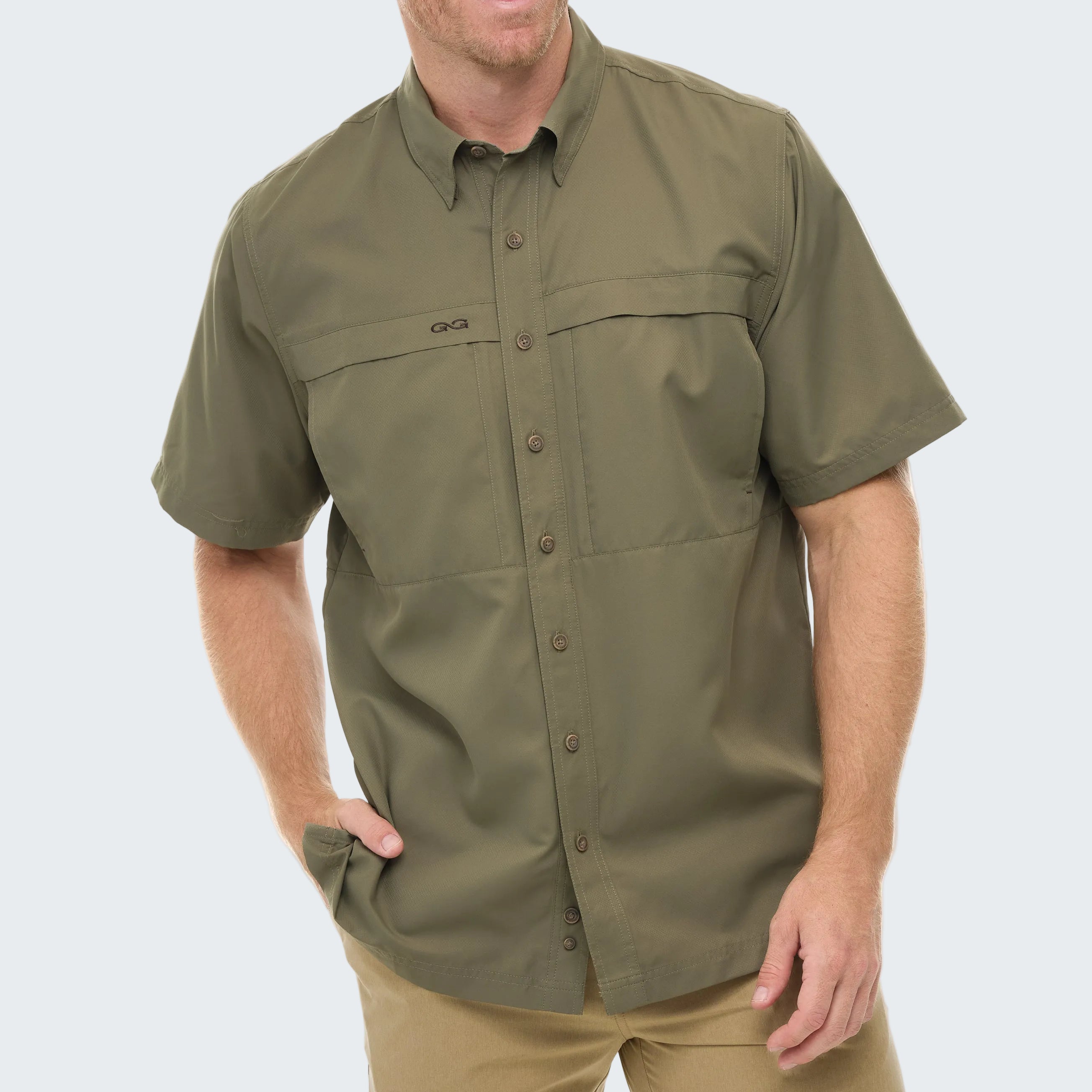 Man wearing a green short-sleeve shirt on a white background