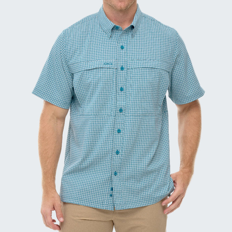 Man wearing a blue checkered shirt on a white background