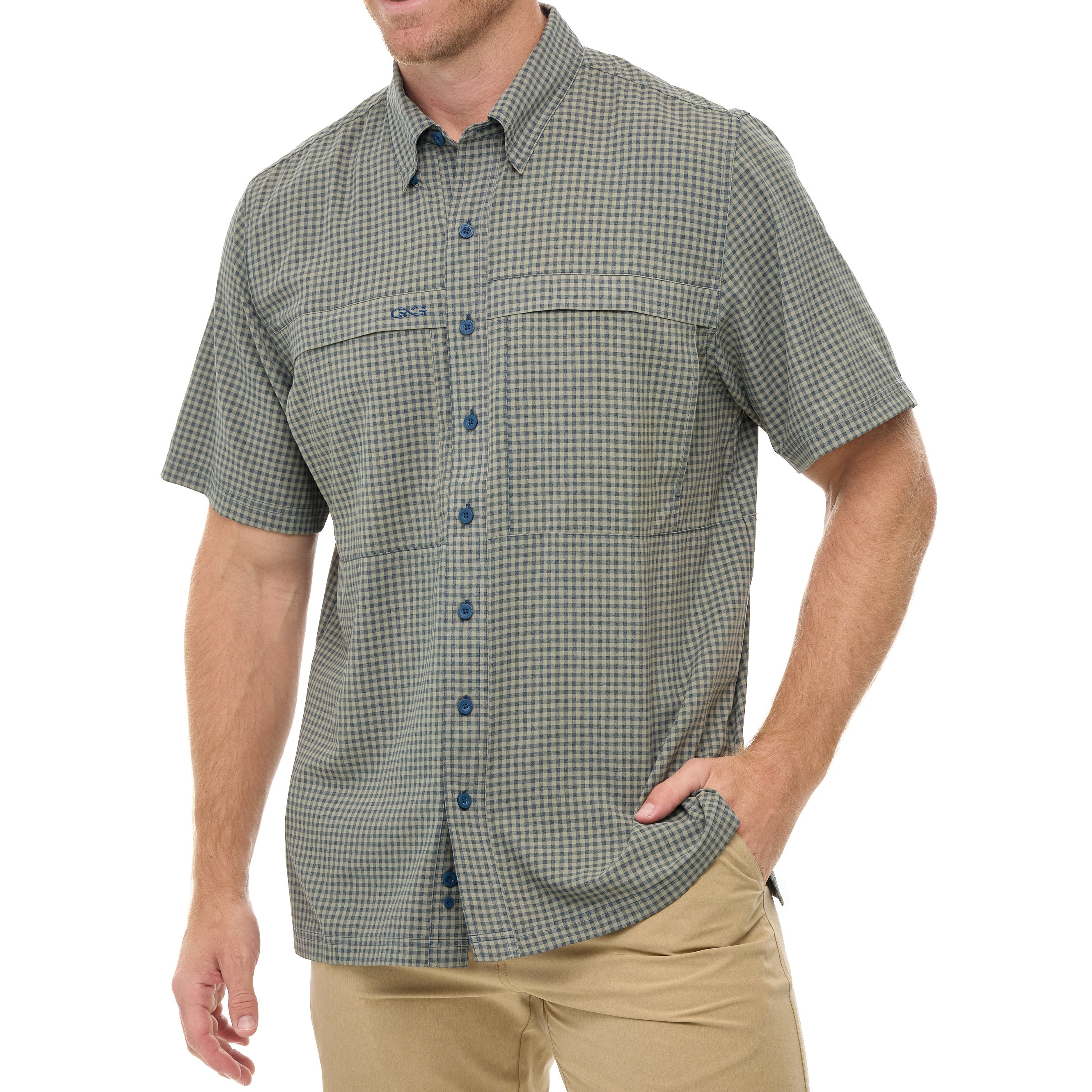 Man wearing a green checkered shirt with buttons on a white background