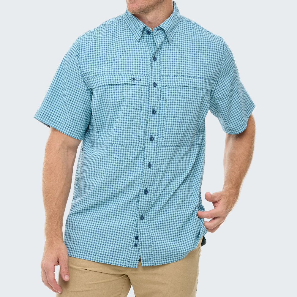 Man wearing a blue checkered shirt on a white background