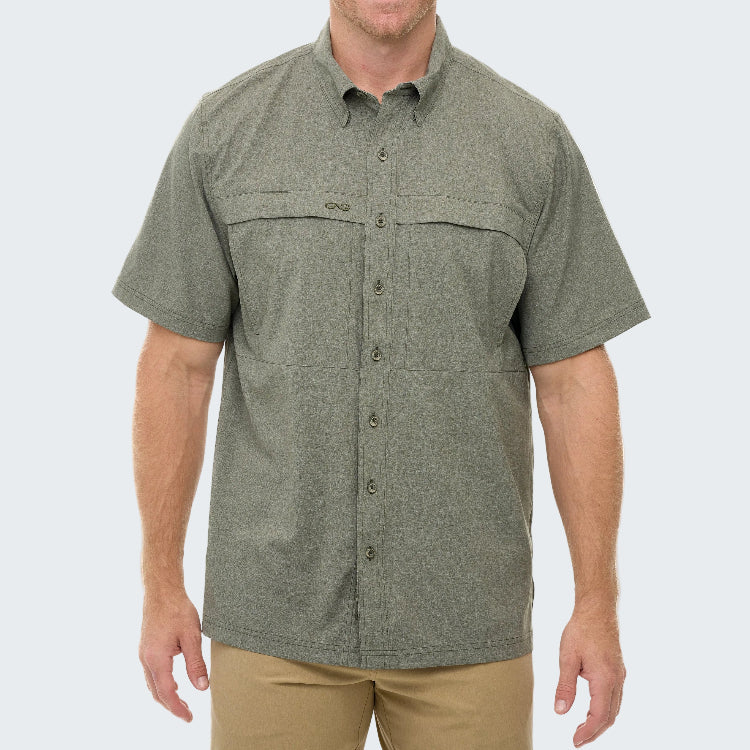 Green short-sleeve shirt worn by a person on a white background