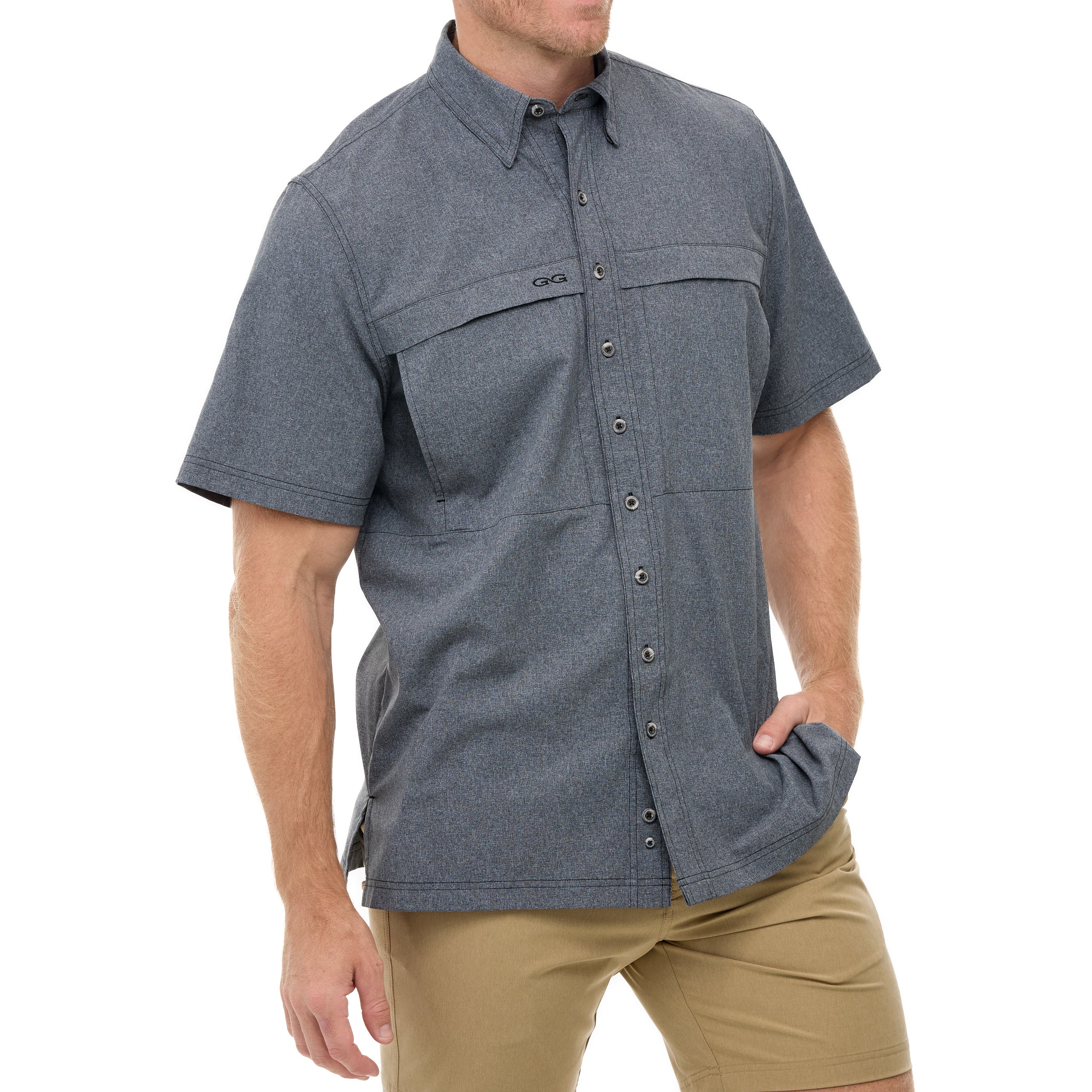 Man wearing a gray short-sleeve shirt with pockets on a white background