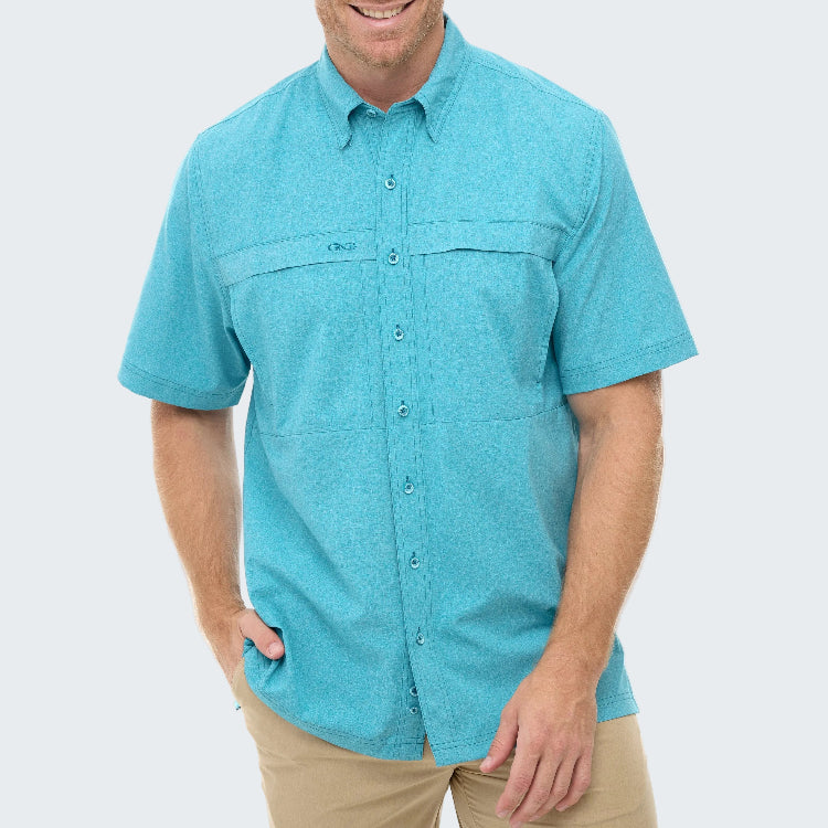 Man wearing a turquoise short-sleeve shirt on a white background