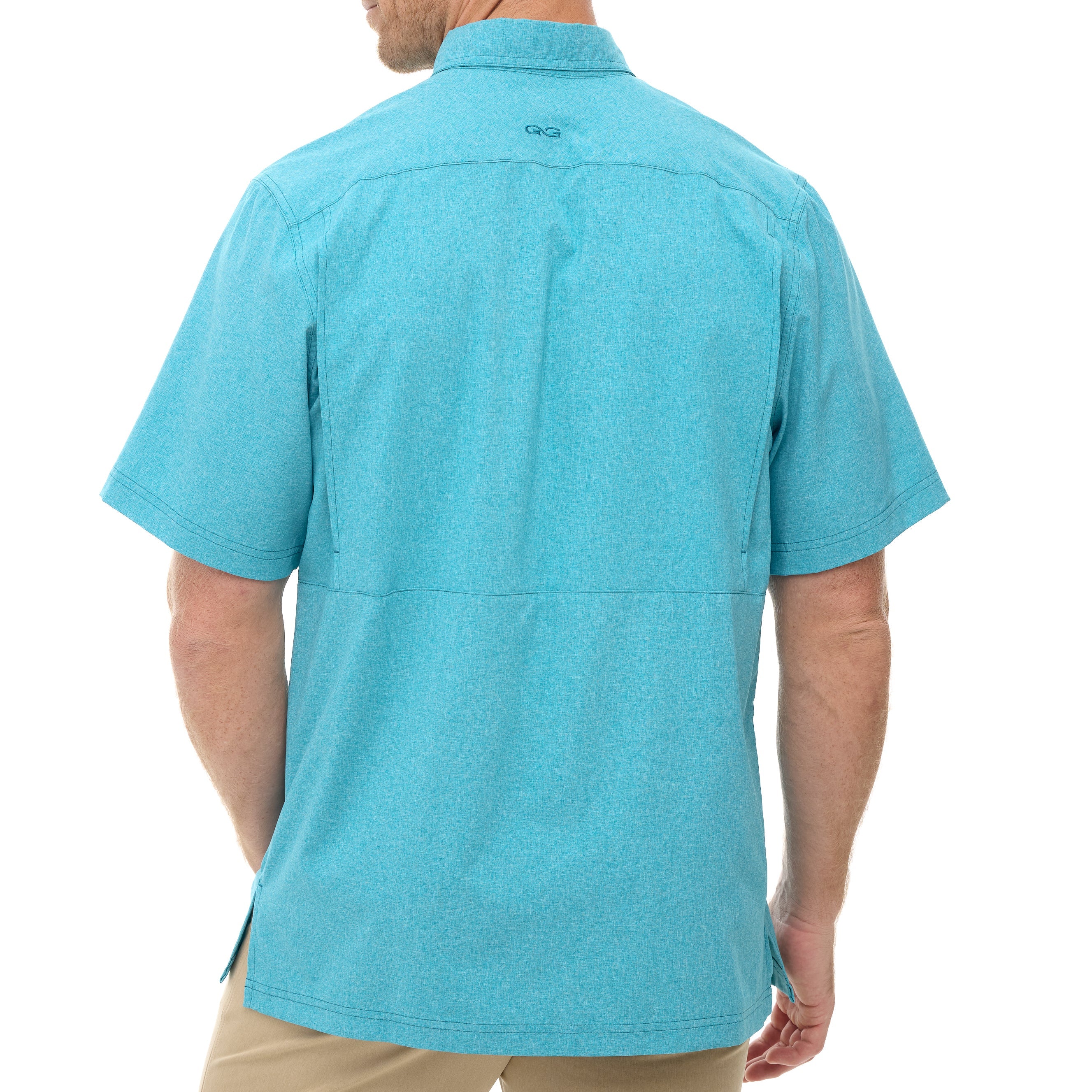 Person wearing a turquoise short-sleeve shirt on a white background