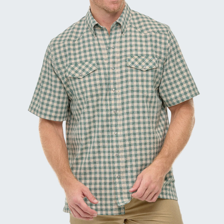 Man wearing a green and white checkered short-sleeve shirt on a white background