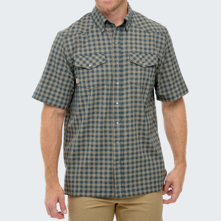 Man wearing a green and brown checkered short-sleeve shirt on a white background