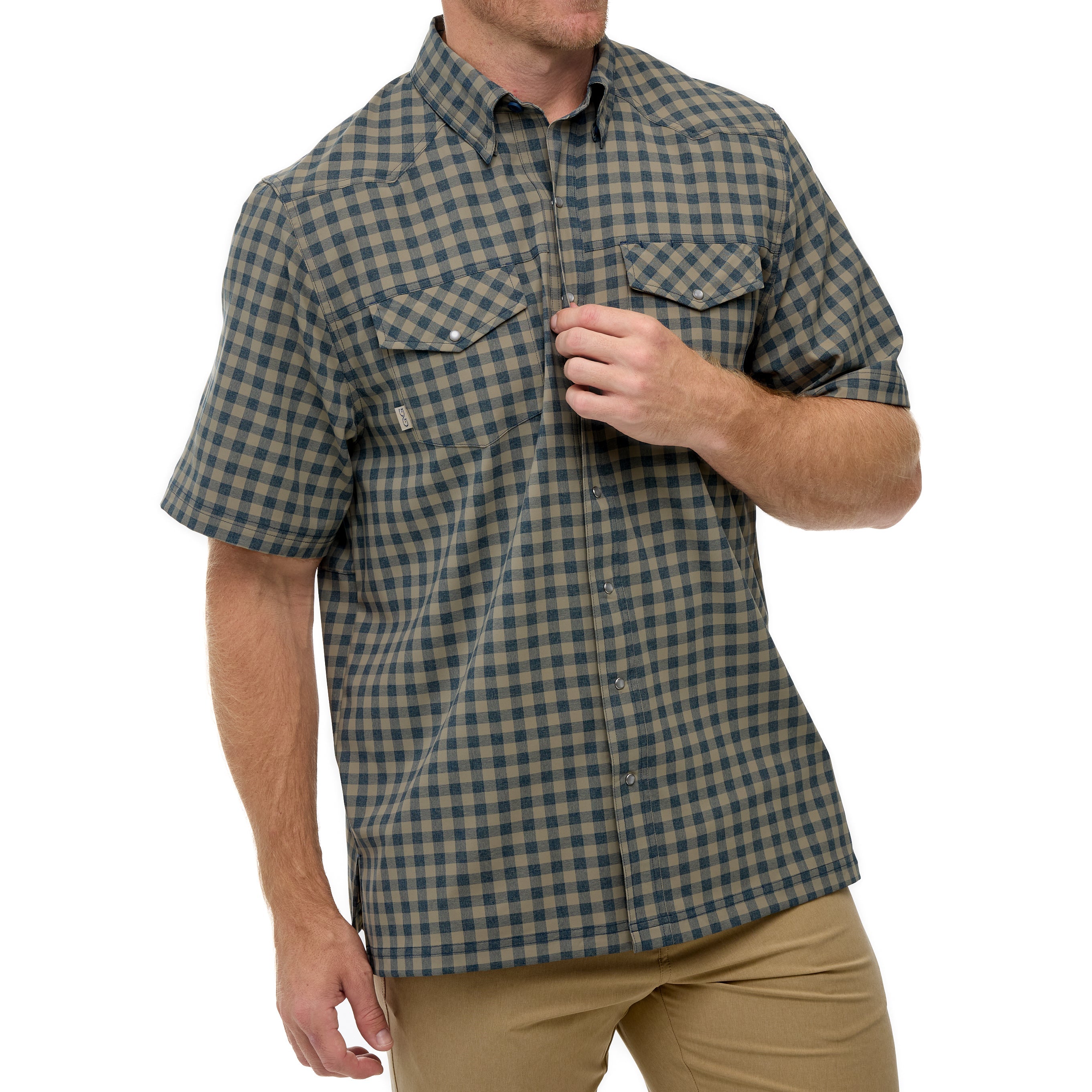 Man wearing a green and brown checkered shirt on a white background