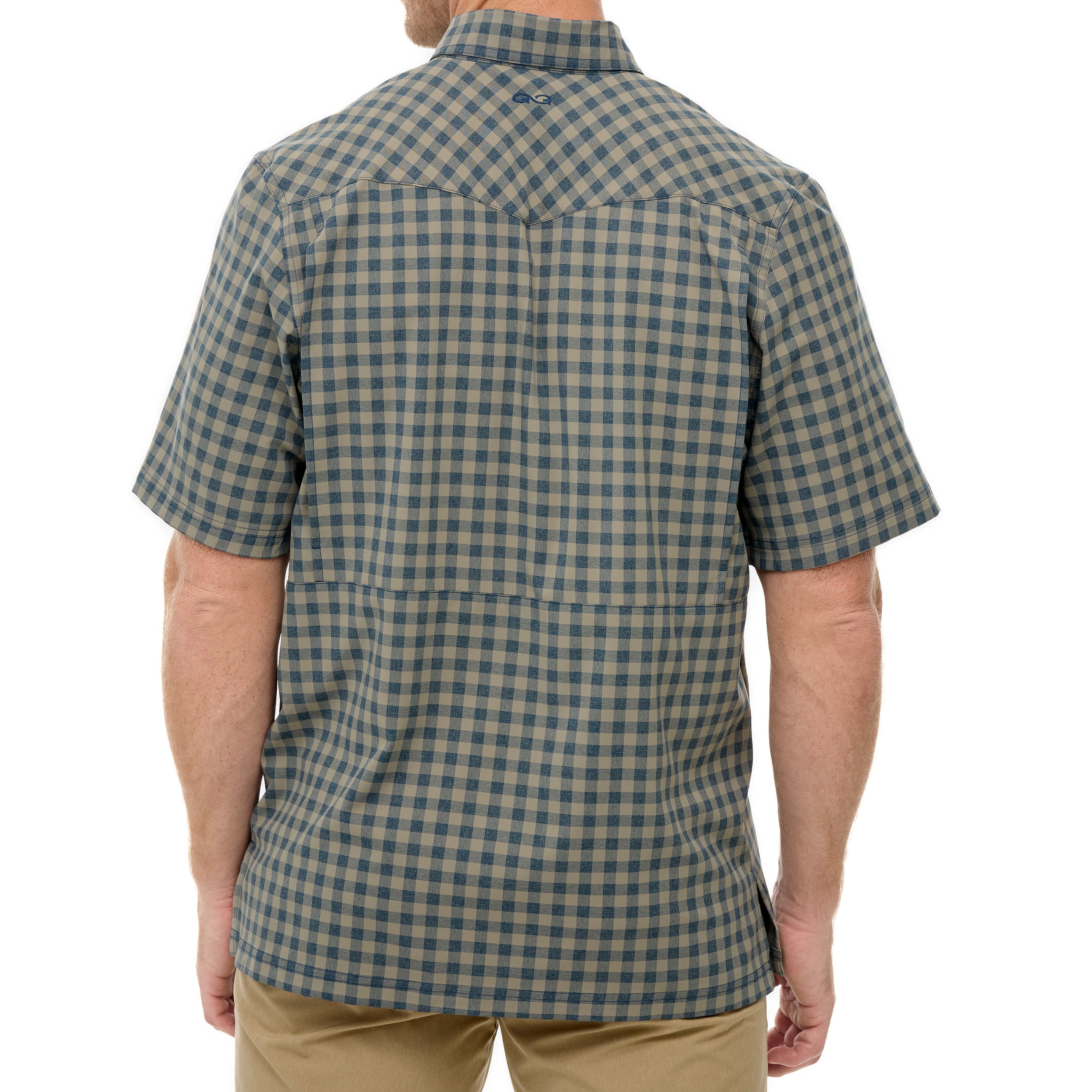 Person wearing a green and beige checkered shirt on a white background