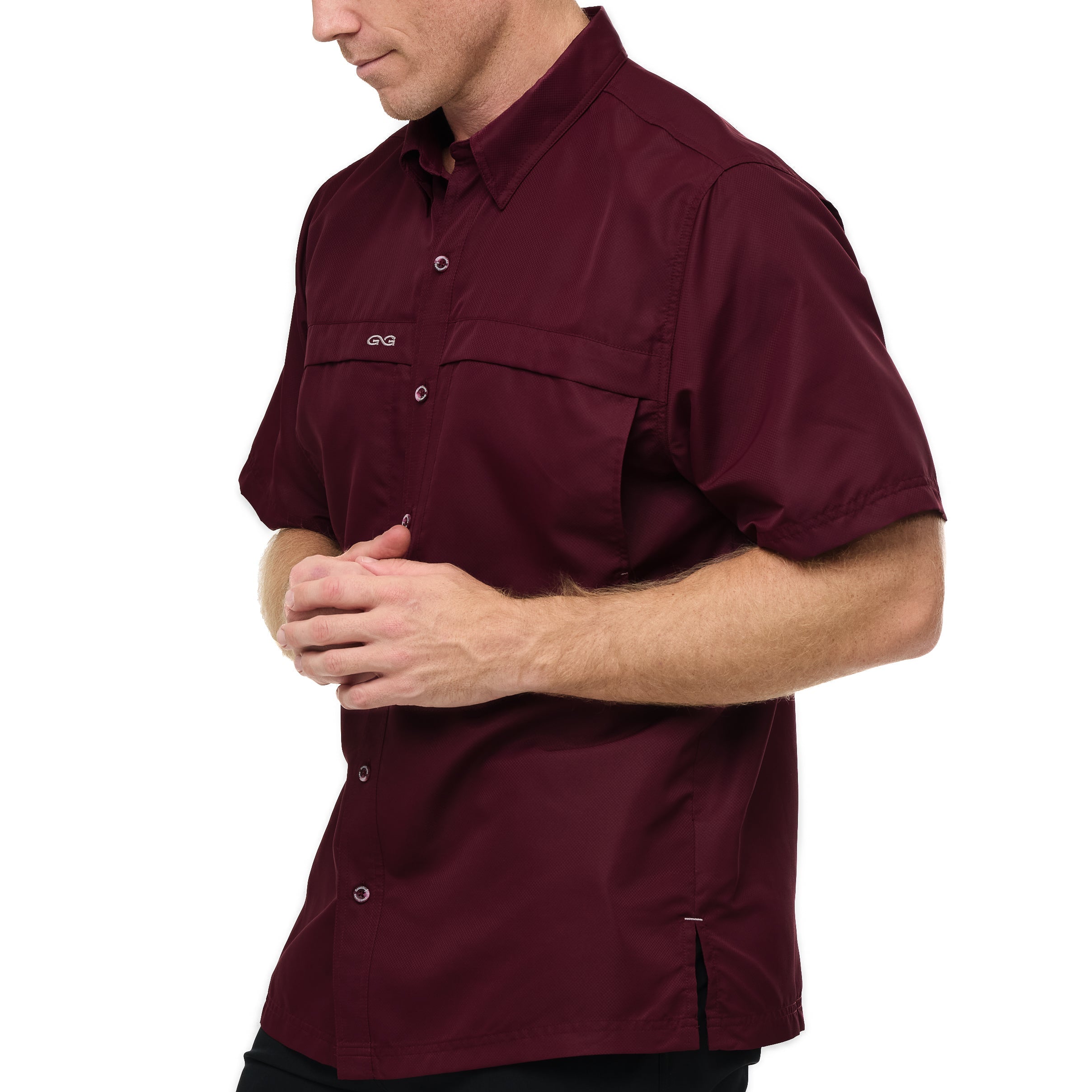 Man wearing a maroon short-sleeve shirt on a white background