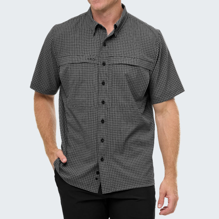 Man wearing a gray checkered short-sleeve shirt on a white background